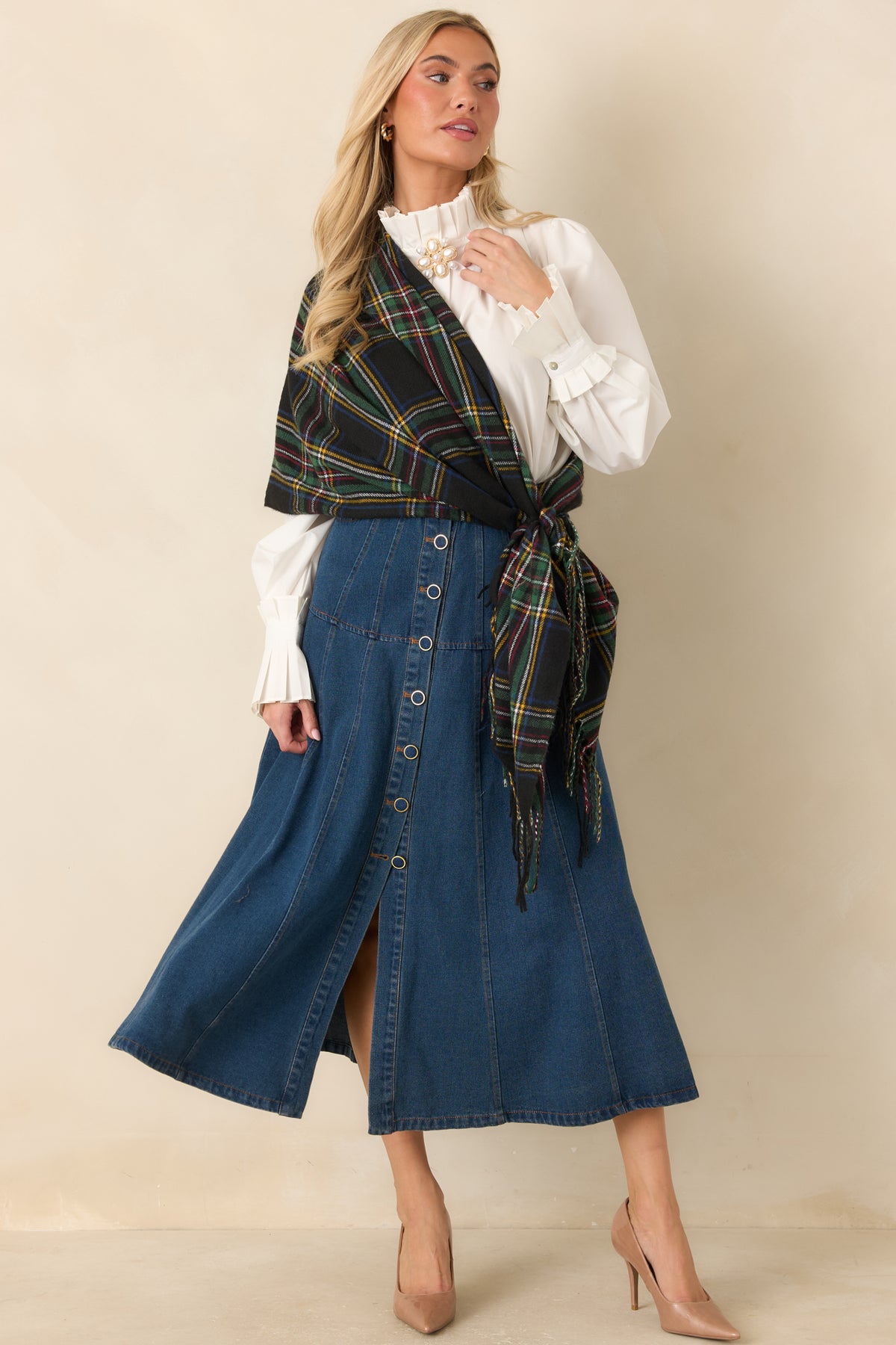 Cotton-blend A-line skirt with front button detailing and curved pockets along the denim panels.