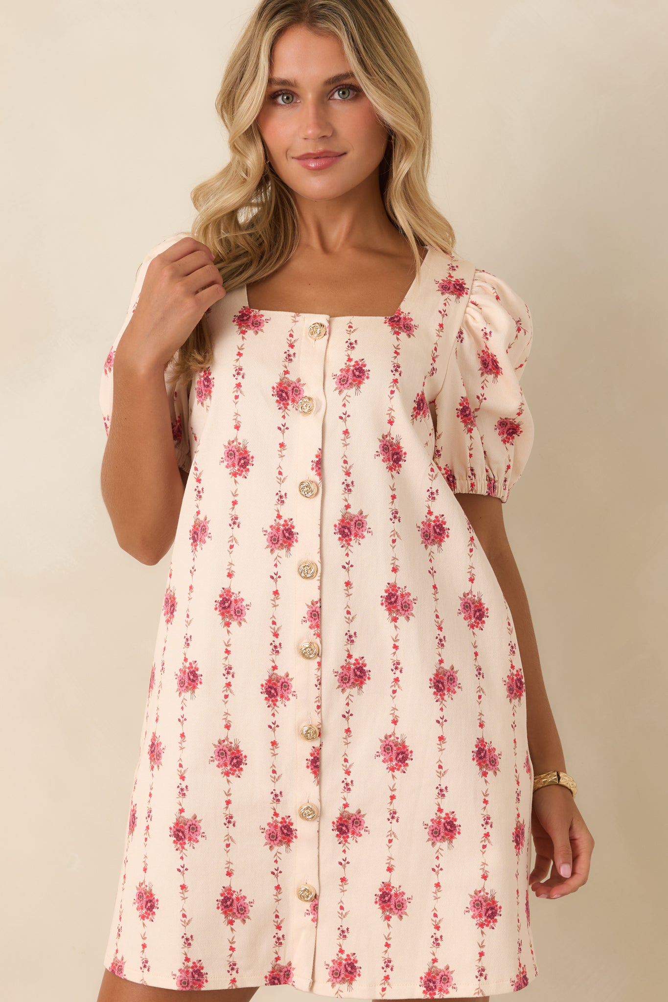 Cotton blend floral dress highlighting the elongated vine pattern, feminine neckline, and tailored construction.