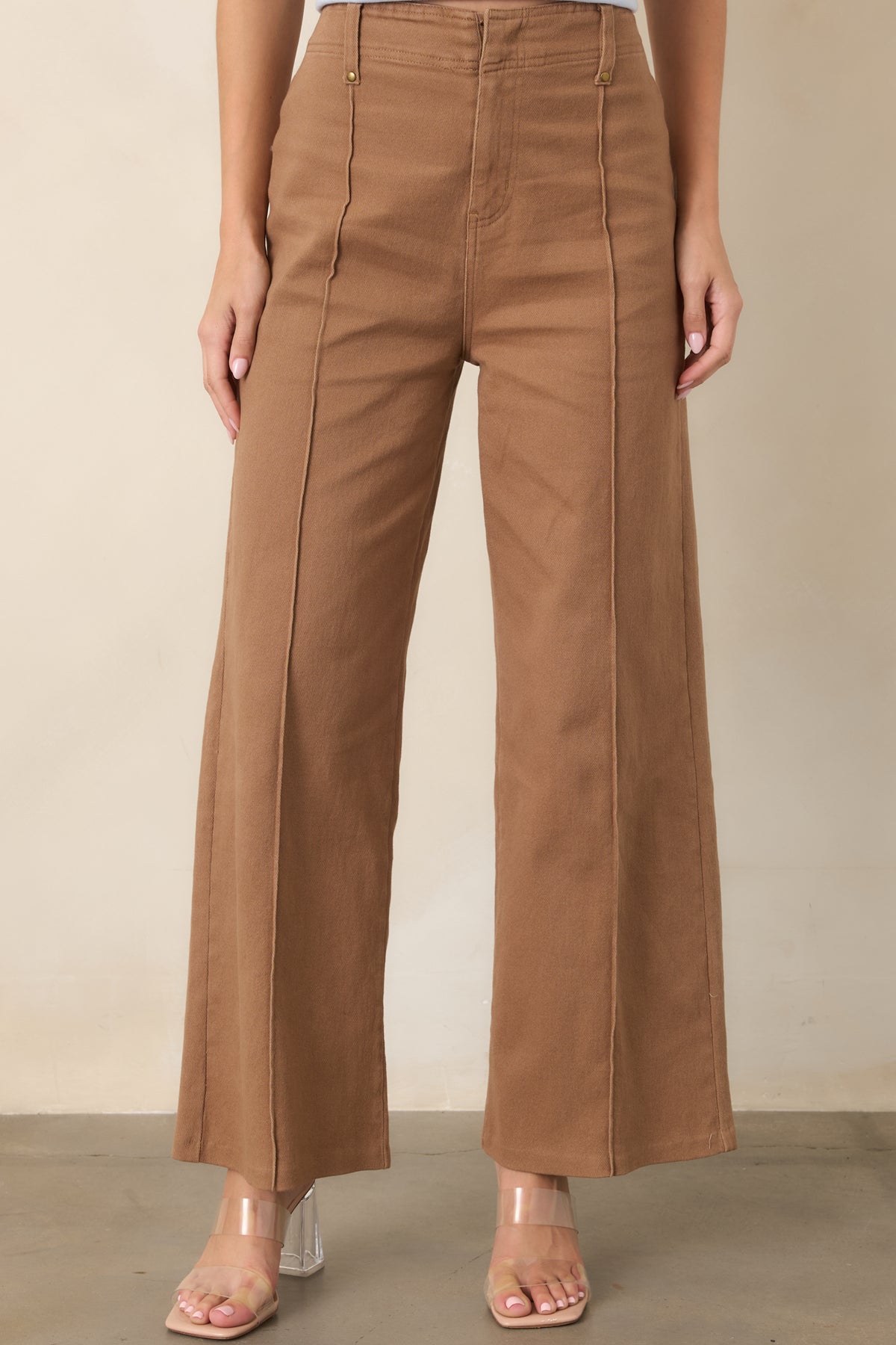 Cotton-blend trousers showcasing the smooth fabric, defined front pleats, and cleanly constructed upper portion.