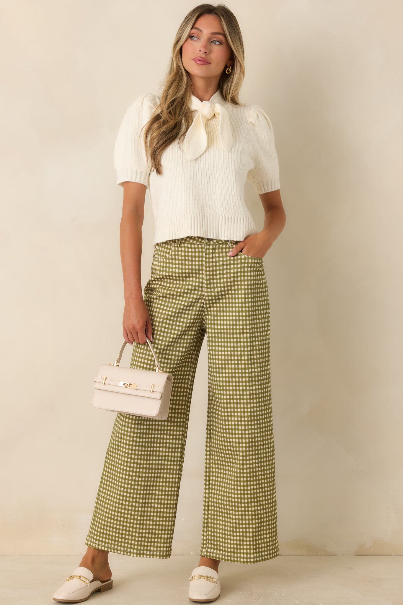 Soft cotton blend pants designed with a timeless gingham print, wide leg fit, and classic polished styling.