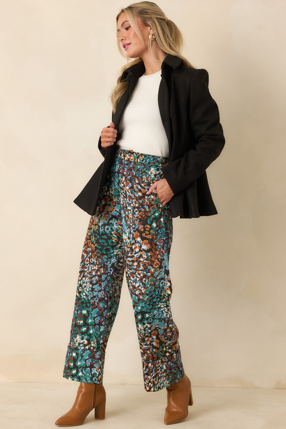 Cotton blend pants showcasing the colorful abstract animal print against a black background.