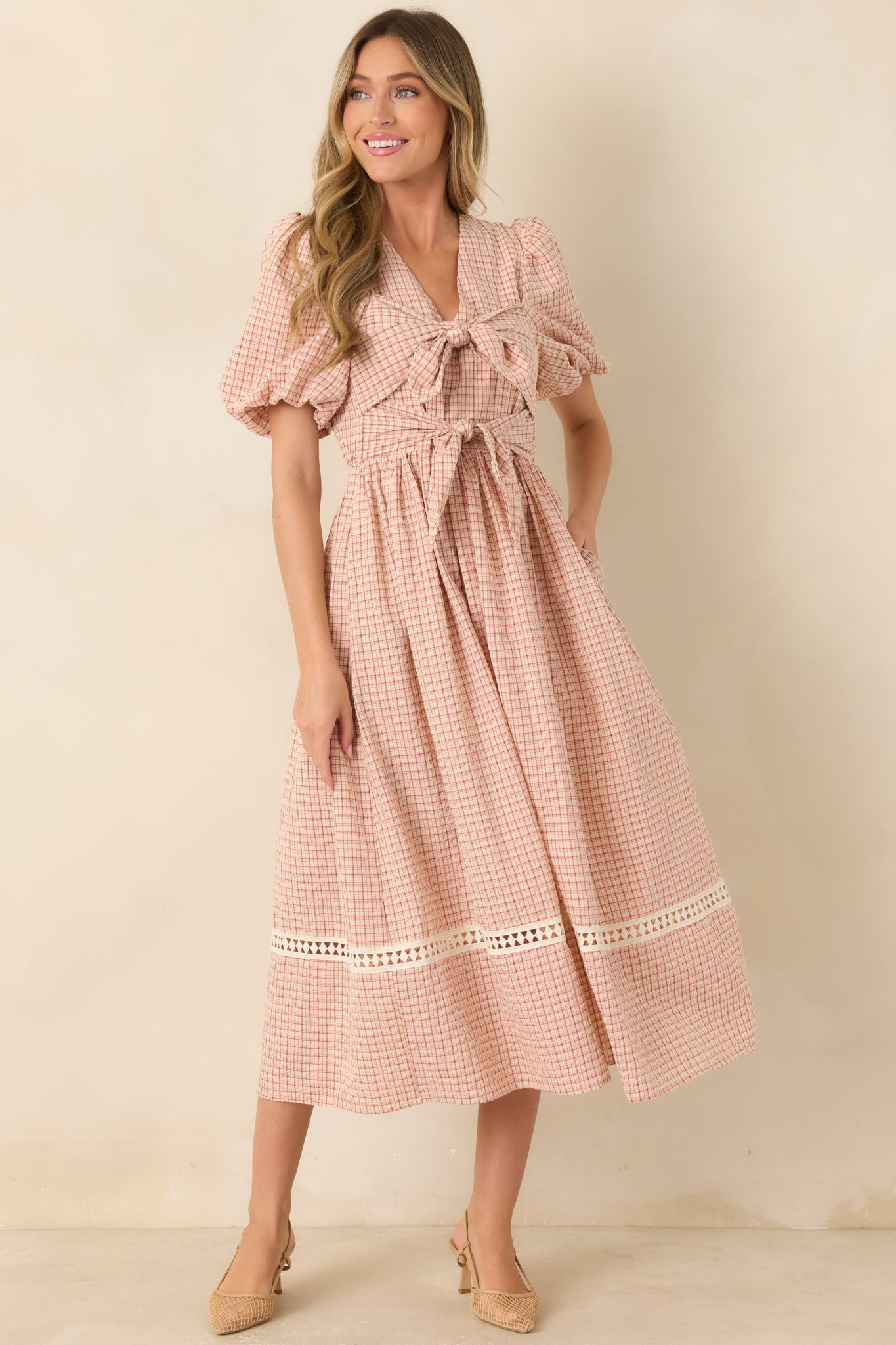 Cotton-blend plaid dress showcasing a structured fitted bodice, voluminous short sleeves, gathered elastic waist, and flowing midi-length skirt.