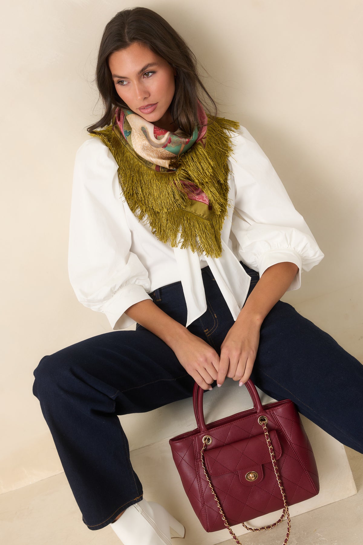 Cotton-blend blouse featuring a pointed collar, button front, three-quarter sleeves, and softly gathered detailing.