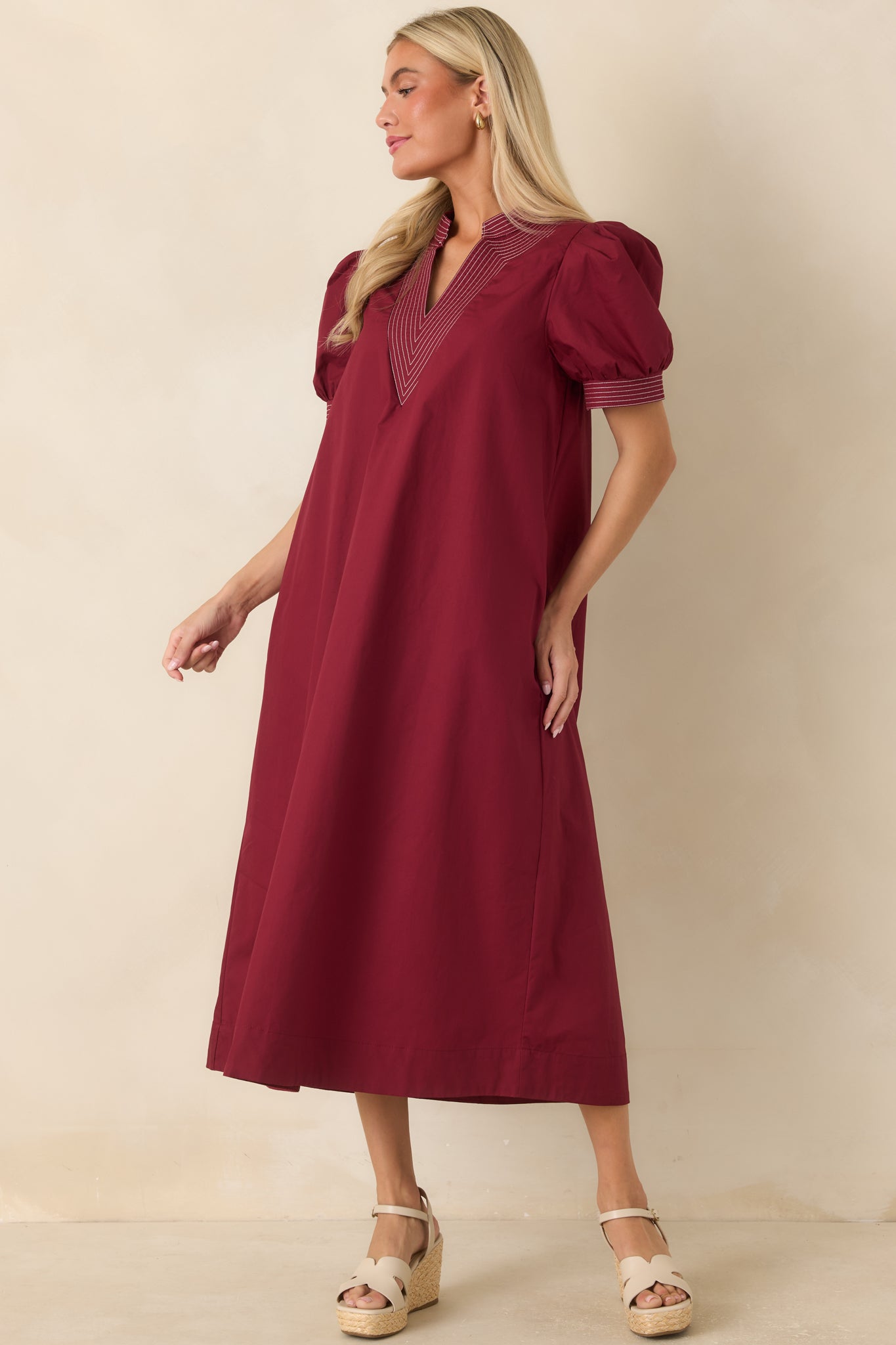 Midi dress crafted from 100% cotton with a structured neckline, side pockets, and an easy A-line shape.