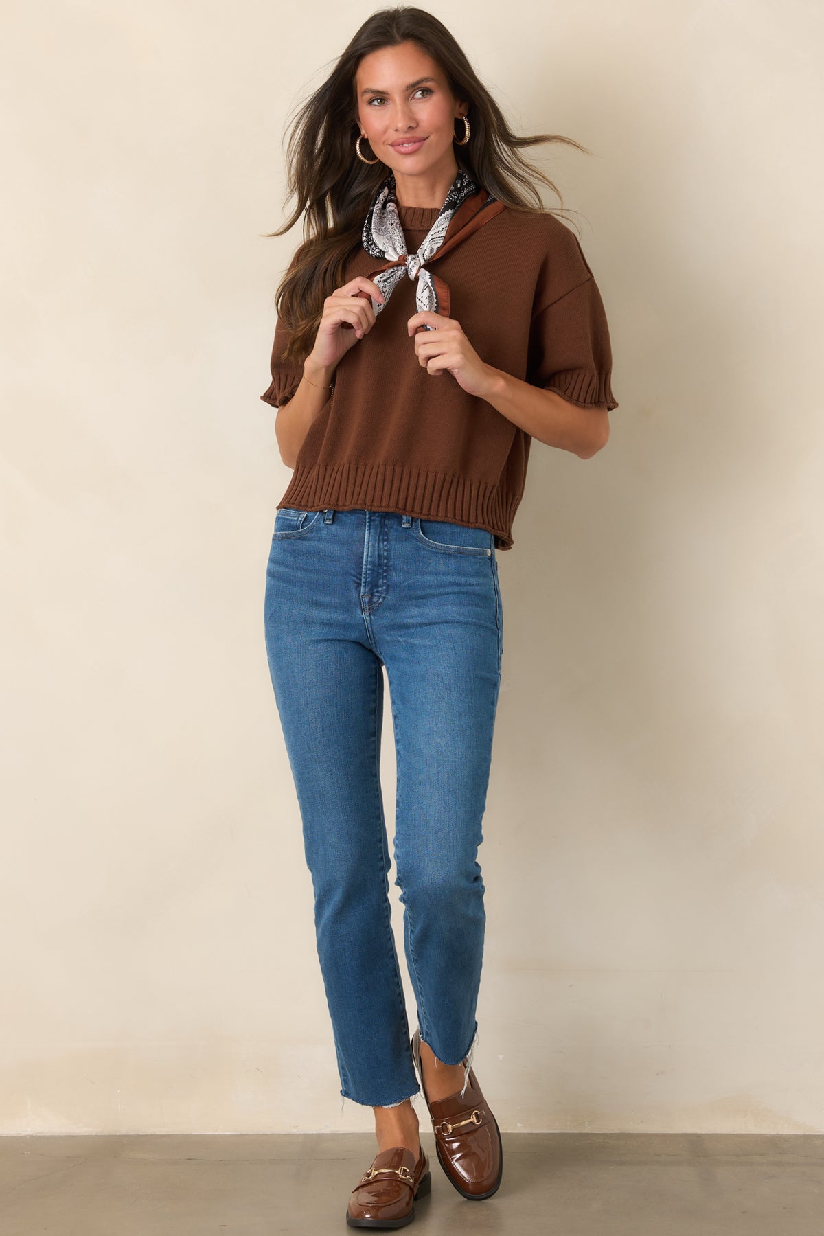 Cotton top featuring a crew neckline, relaxed short sleeves, and chunky ribbed trim.