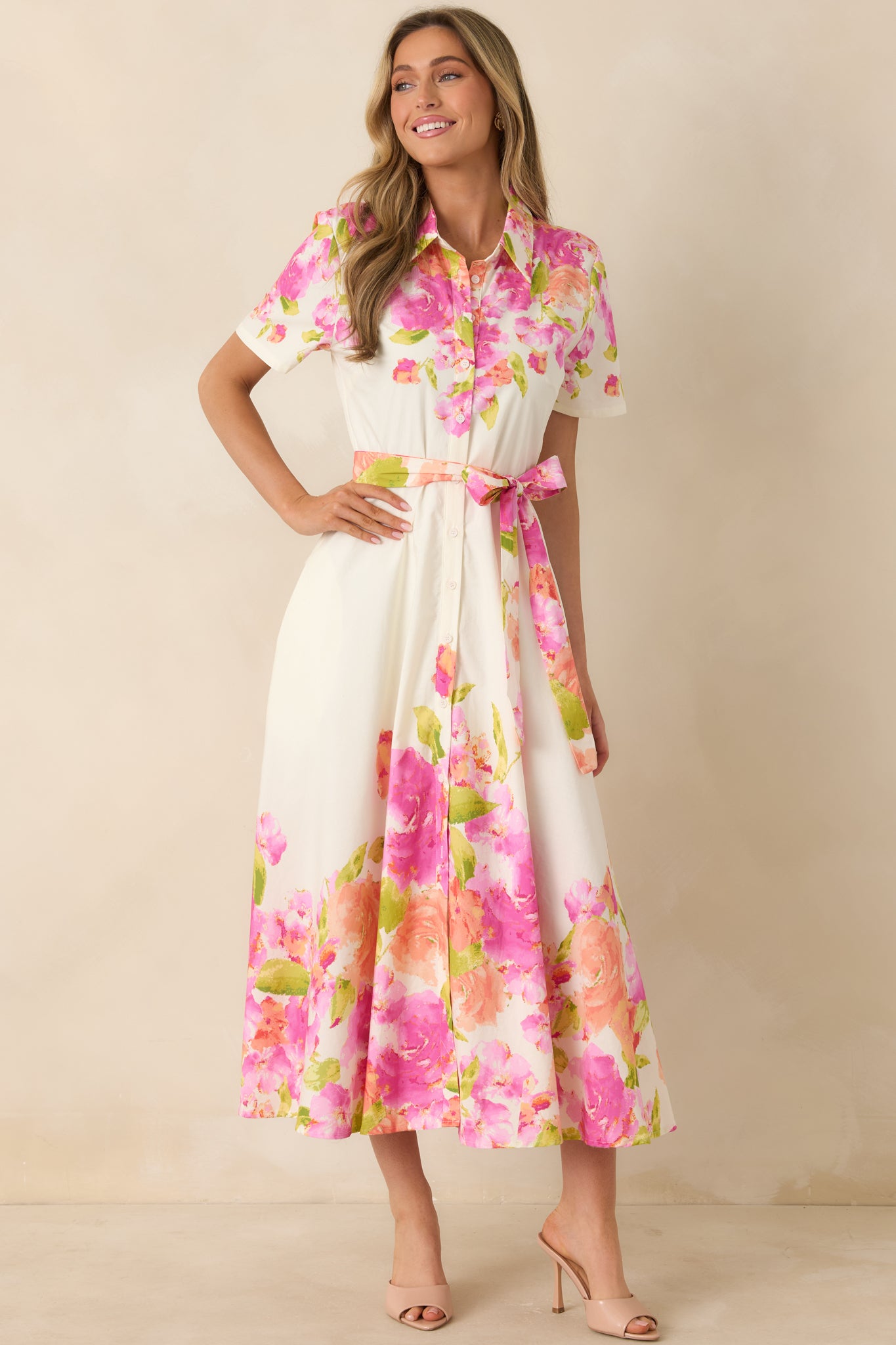 100% cotton dress featuring classic collar, structured bodice, and airy midi silhouette.
