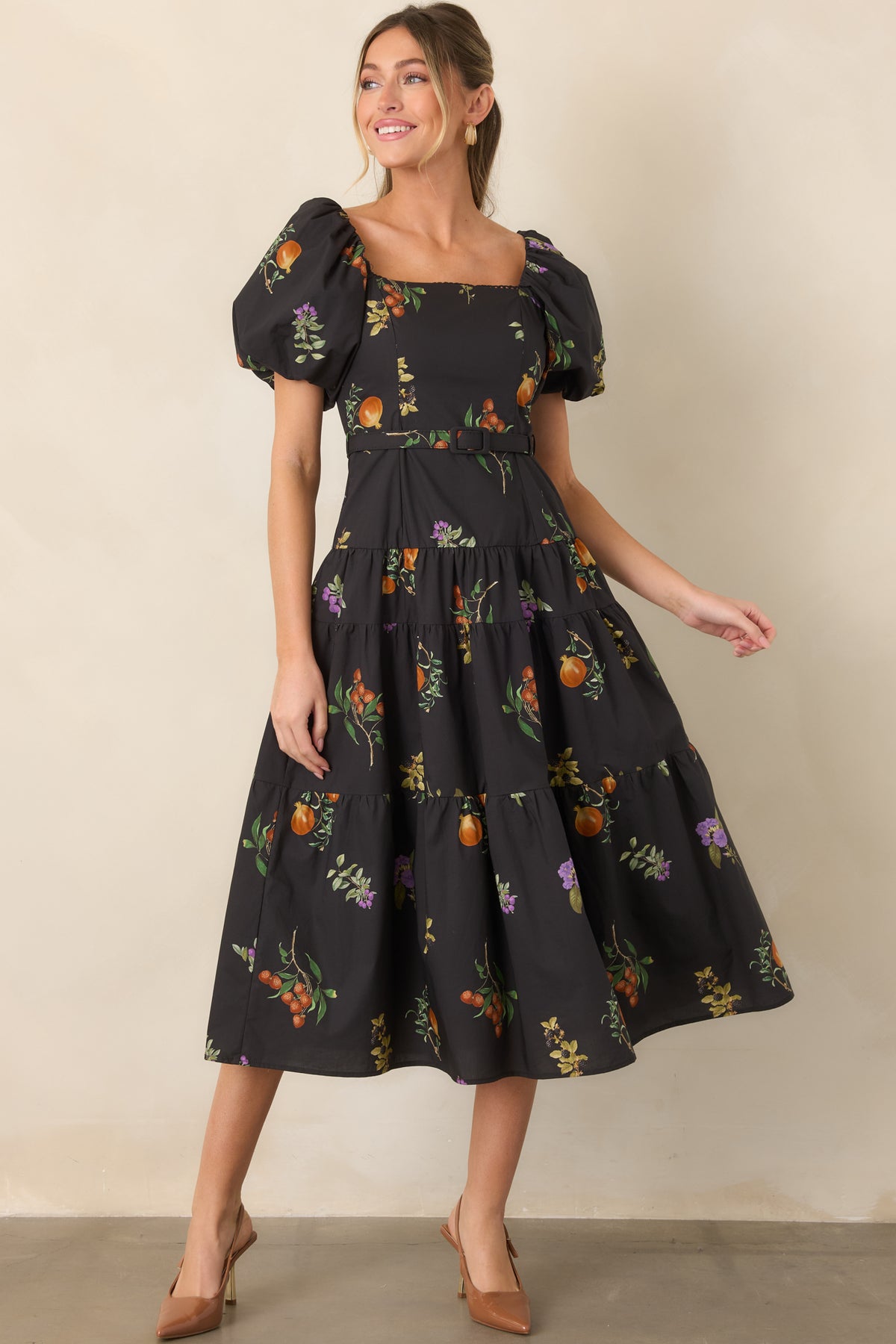 Cotton dress designed with a square neckline, shaped princess seams, dramatic sleeves, and a coordinating belt at the waist.