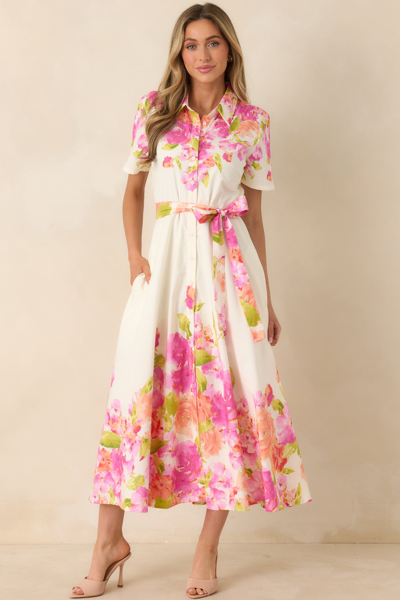 Cotton dress with collared neckline, button-front closure, short sleeves, and full midi-length skirt.