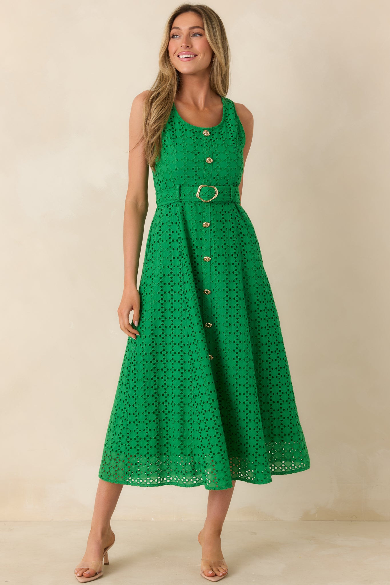Cotton eyelet midi dress with faux button front and structured silhouette.