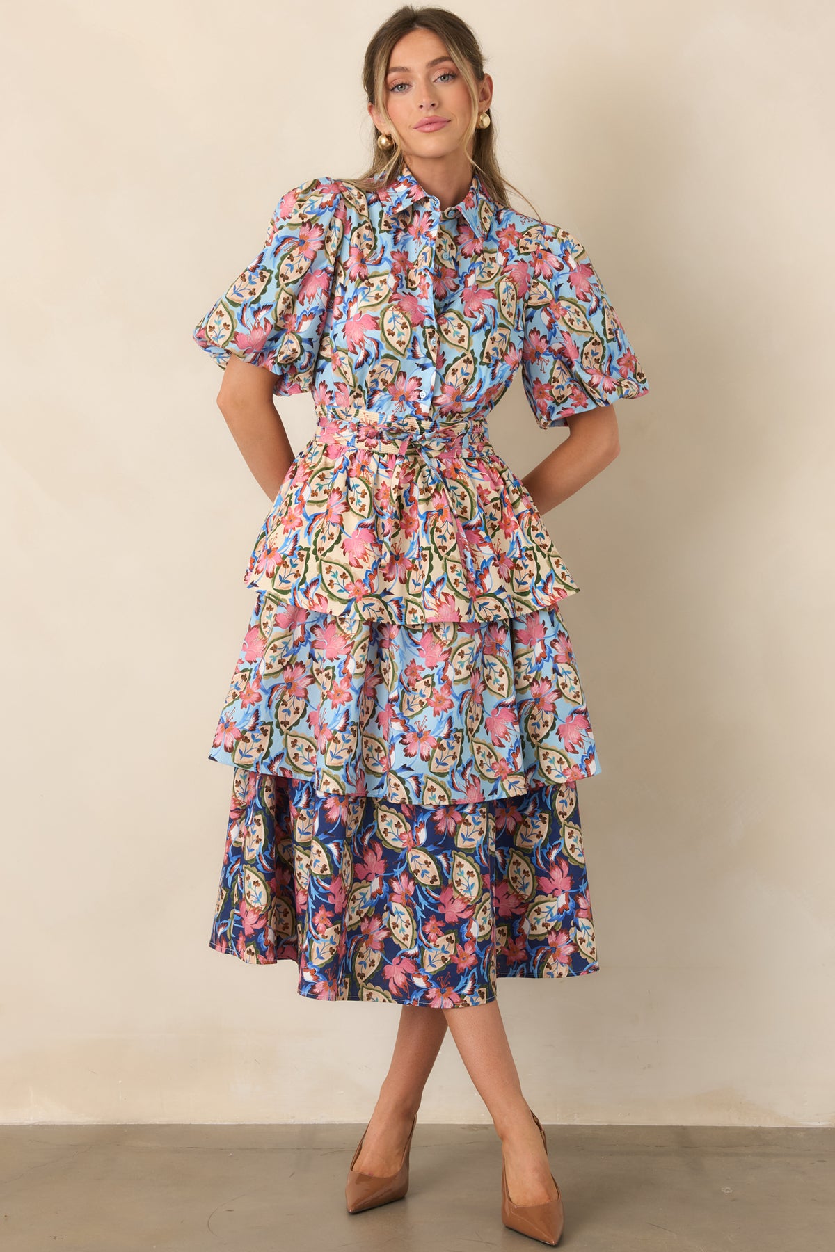 Cotton-blend floral dress with a pointed collar, button-front bodice, short puff sleeves, and matching waist tie.