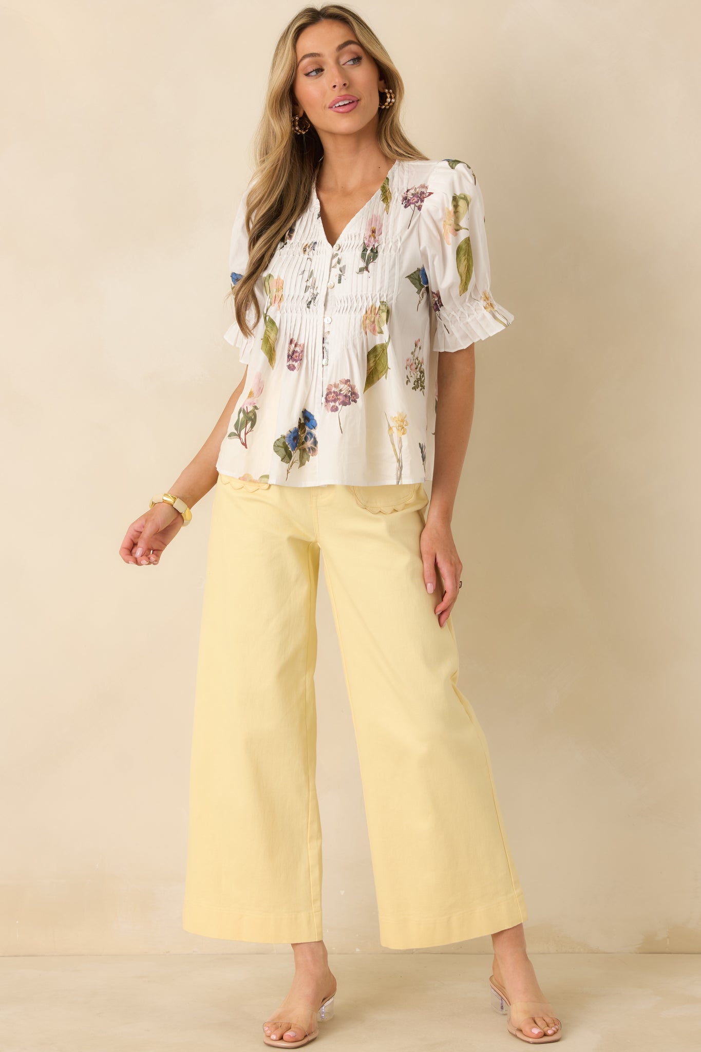 Cotton floral top with puff sleeves and elasticized, ruffled cuffs for a charming sleeve finish.