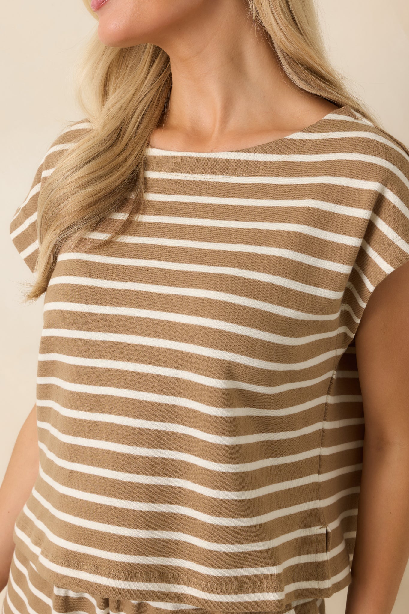 Close-up of the cotton knit top featuring the textured fabric, taro brown and ivory stripes, and neckline details.
