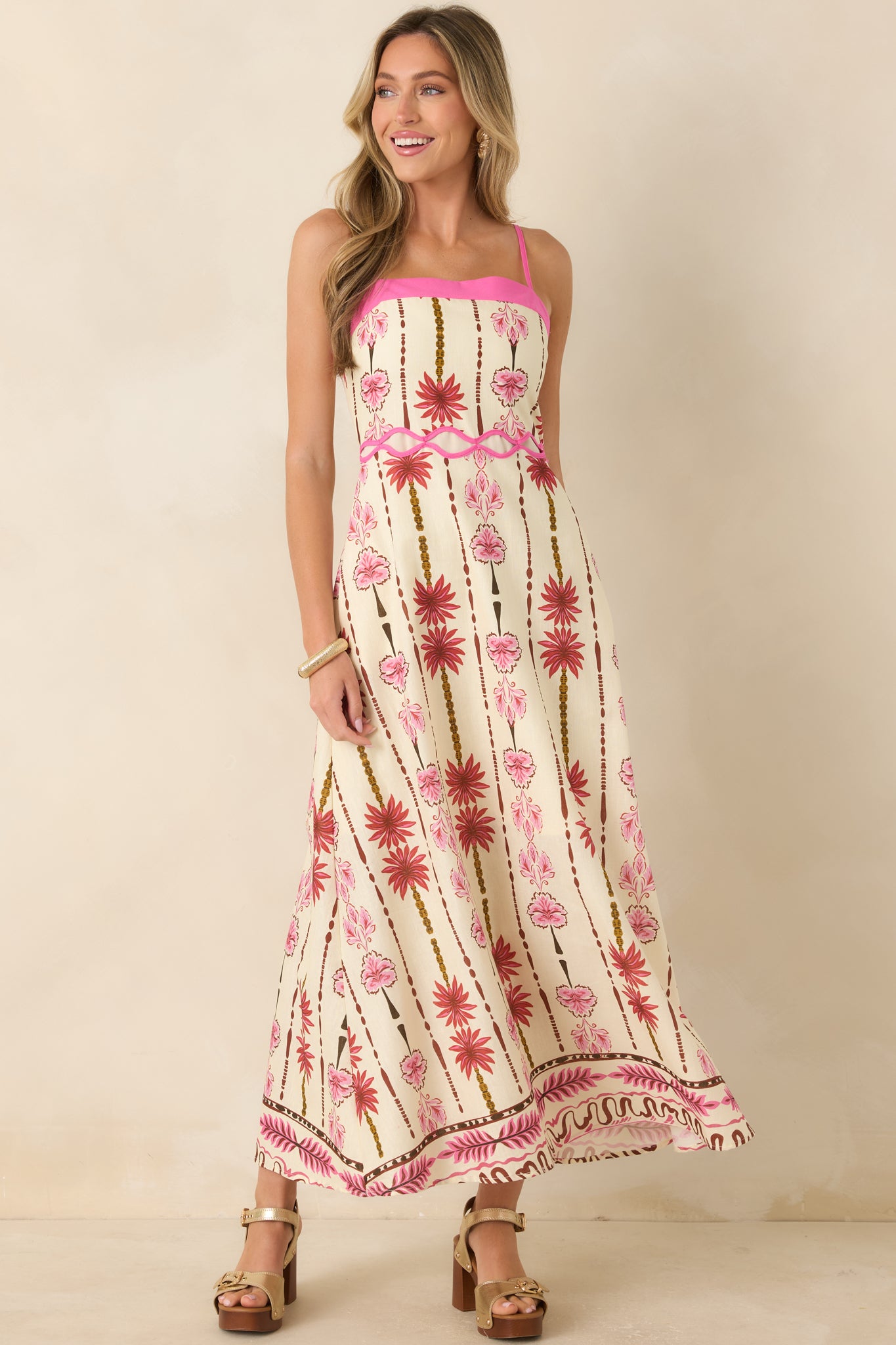 Breathable cotton linen maxi dress showcasing a feminine floral print, adjustable shoulder straps, and a comfortable flowing skirt.