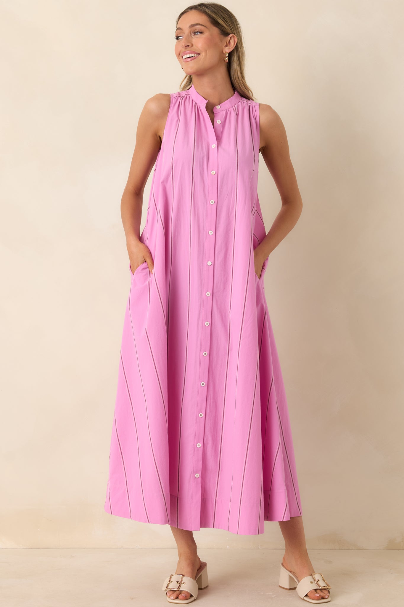 Cotton maxi dress featuring vertical stripes and softly flared silhouette.