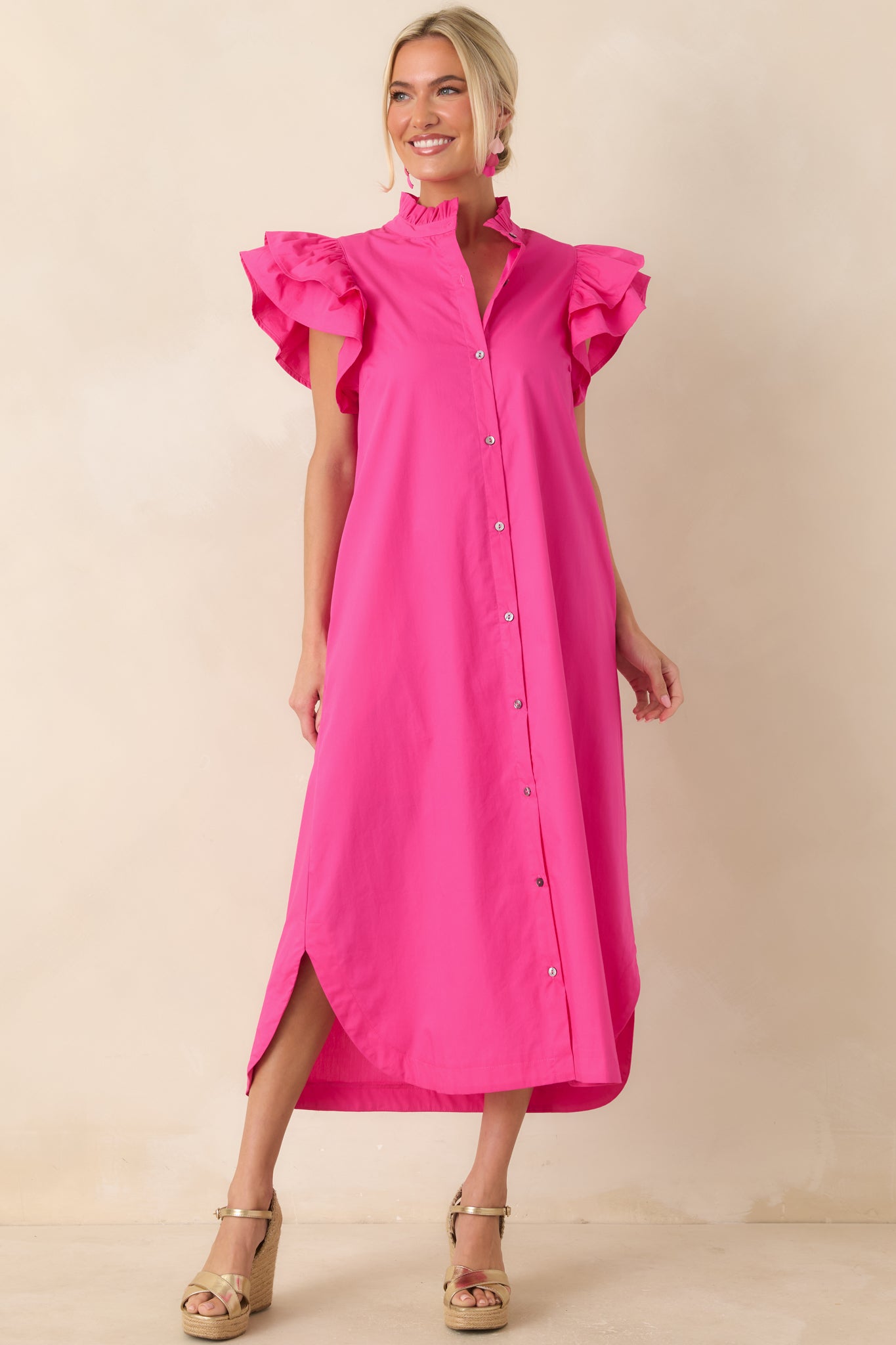 Cotton midi dress showcasing a ruffled collar, functional front buttons, and a softly tailored shape for everyday wear.