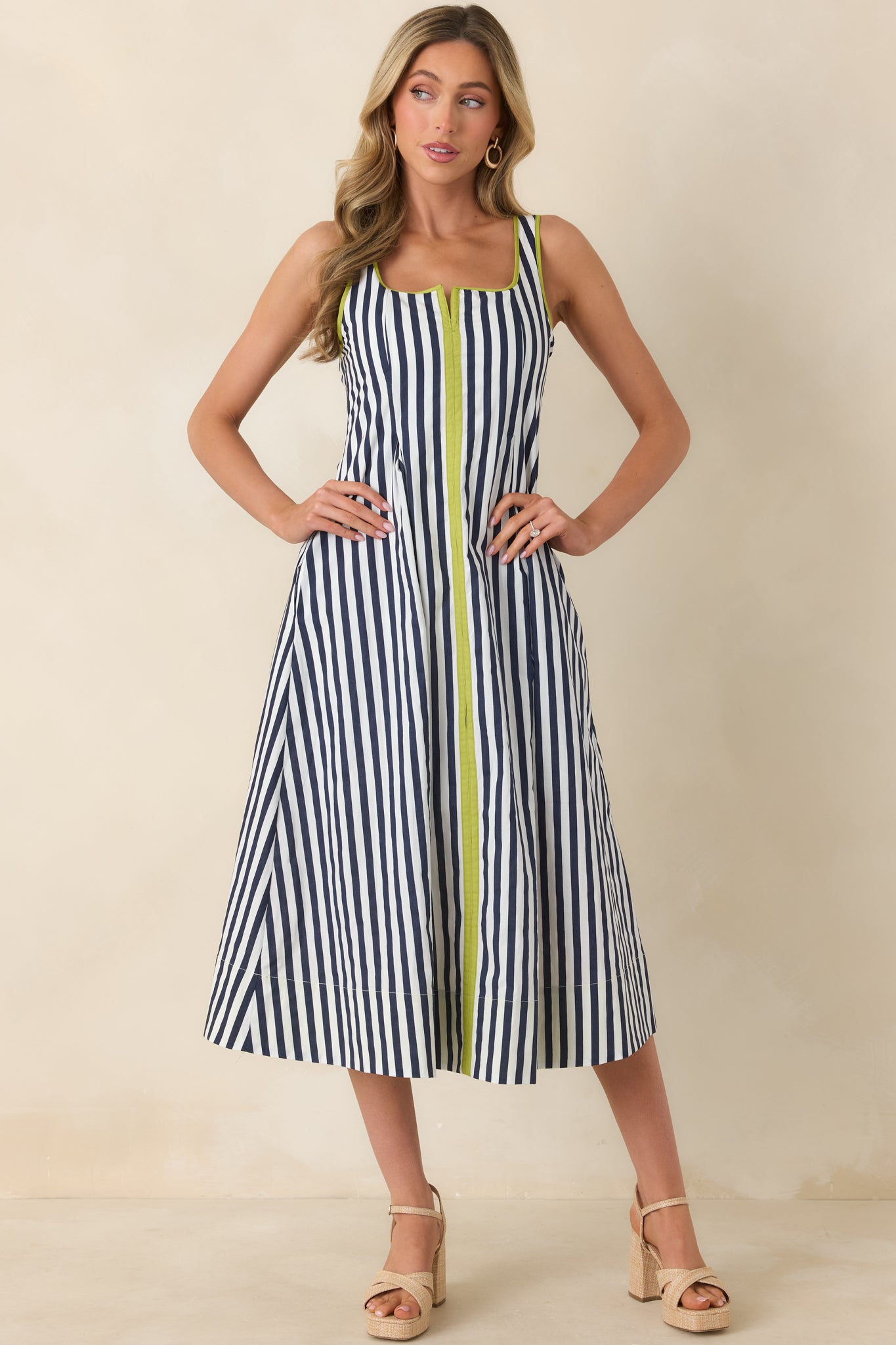 Full front view of the cotton midi dress showing side pockets and clean, streamlined fit.