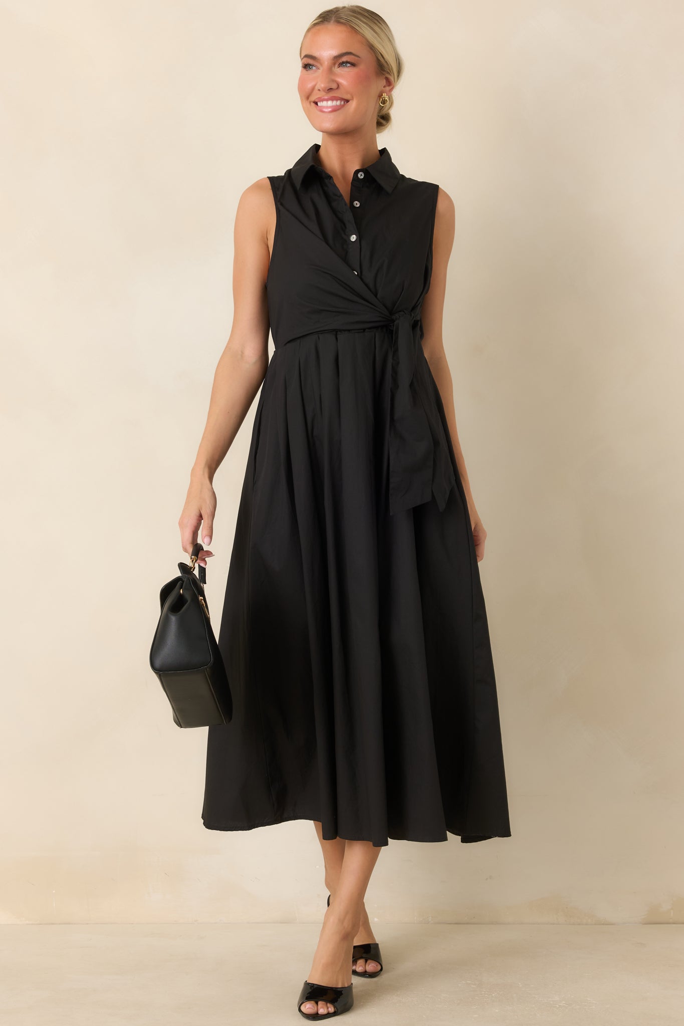 Cotton midi dress featuring a collared neckline, partial button front, faux wrap waist tie, and gathered skirt.