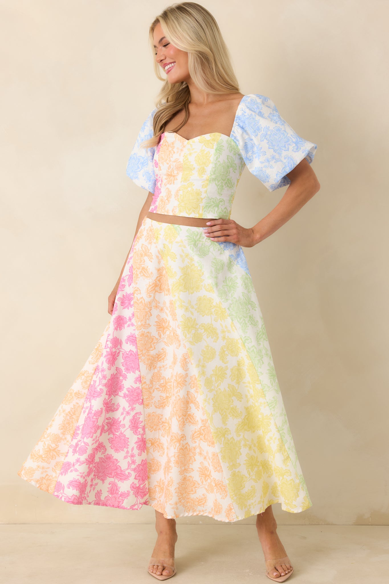 Cotton linen-blend midi skirt with high-rise fit, full silhouette, and vibrant multi-floral color-block print.