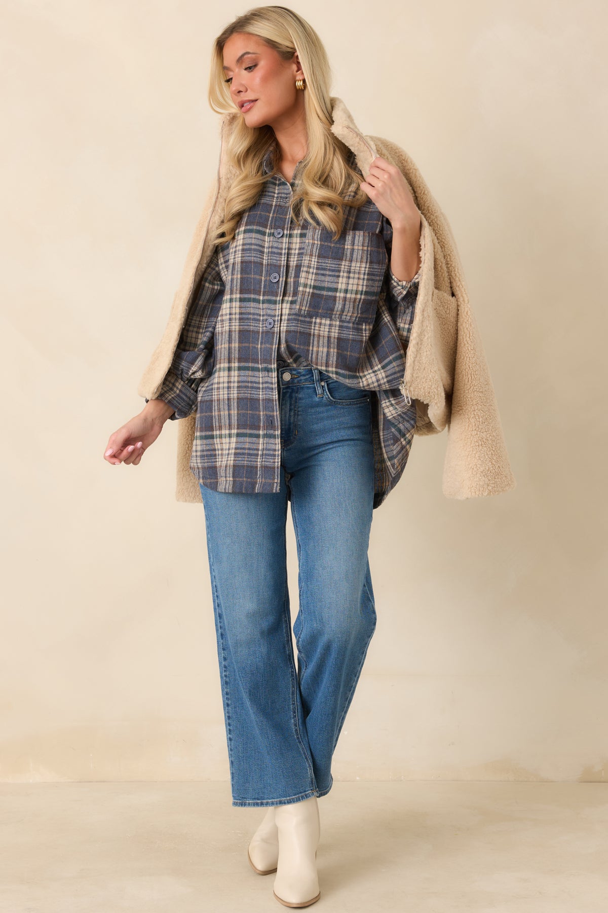 Cotton plaid shirt in slate blue, beige, forest green, and brown with a pointed collar and button front.