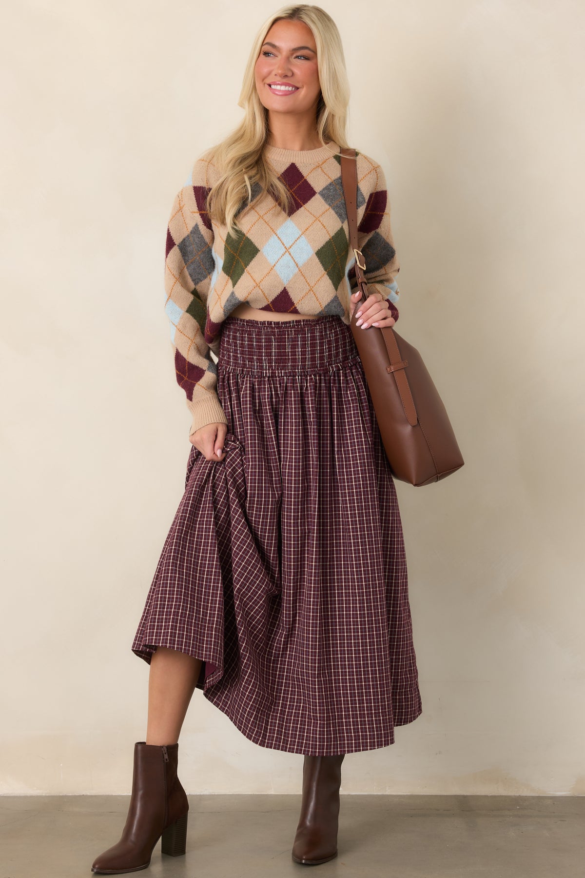 Cotton plaid maxi skirt featuring a stretchy smocked drop waist, delicate ruffle trim, and a flowing gathered silhouette.