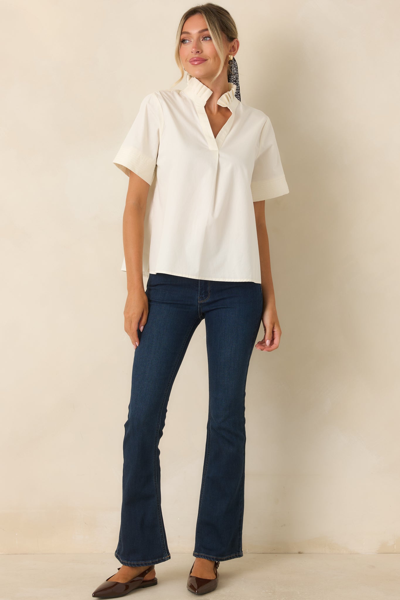 Breathable cotton top featuring a pleated ruffle collar, split neckline, short sleeves, and a relaxed silhouette.