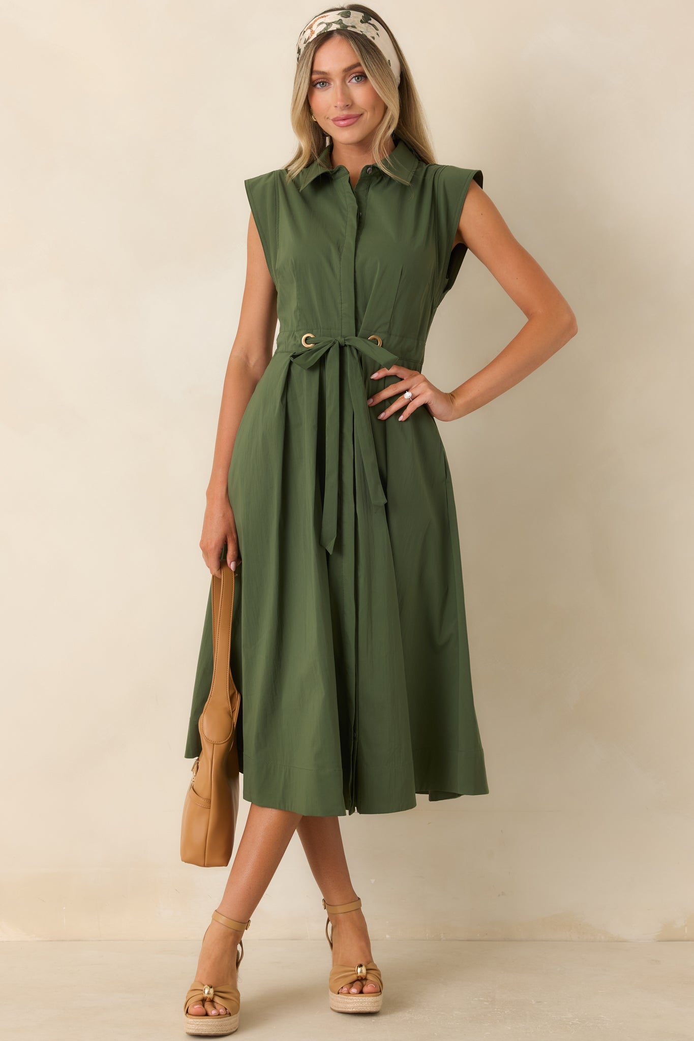 Cotton poplin dress showcasing a classic shirt dress design, adjustable self-tie belt, and flowing full skirt.