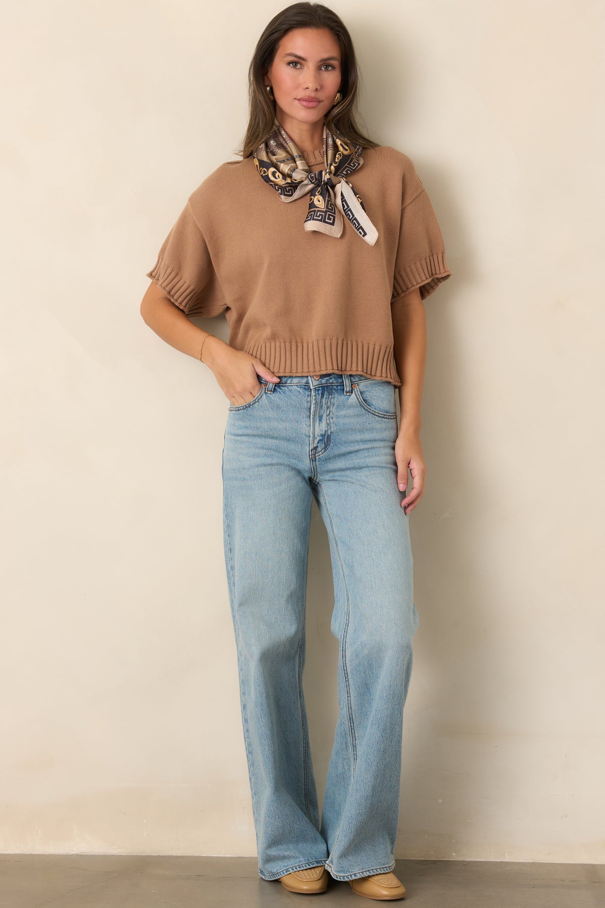 Casual cotton top with relaxed short sleeves and chunky ribbed detailing framing the neckline and edges.
