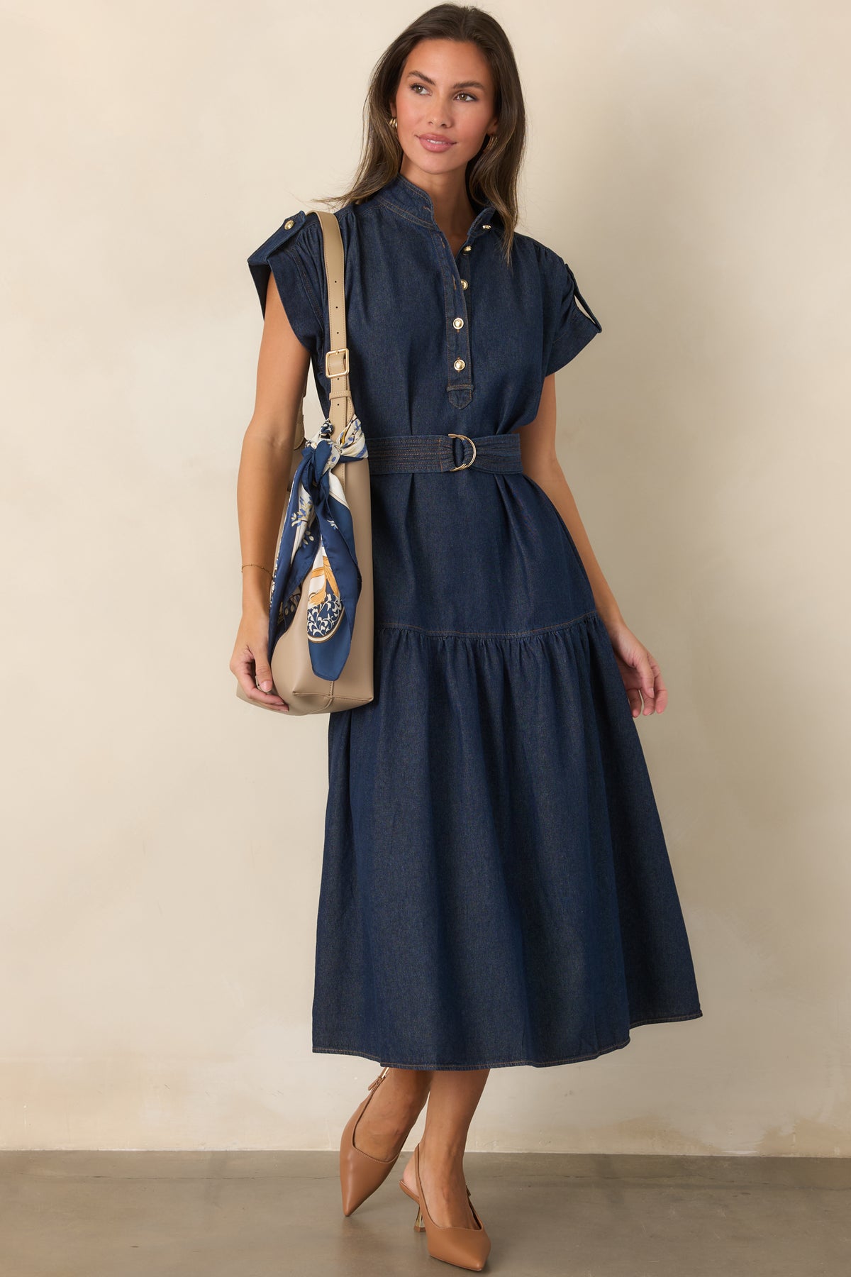 Cotton-rich dress showcasing buttoned sleeve tabs and a coordinating stitched belt.
