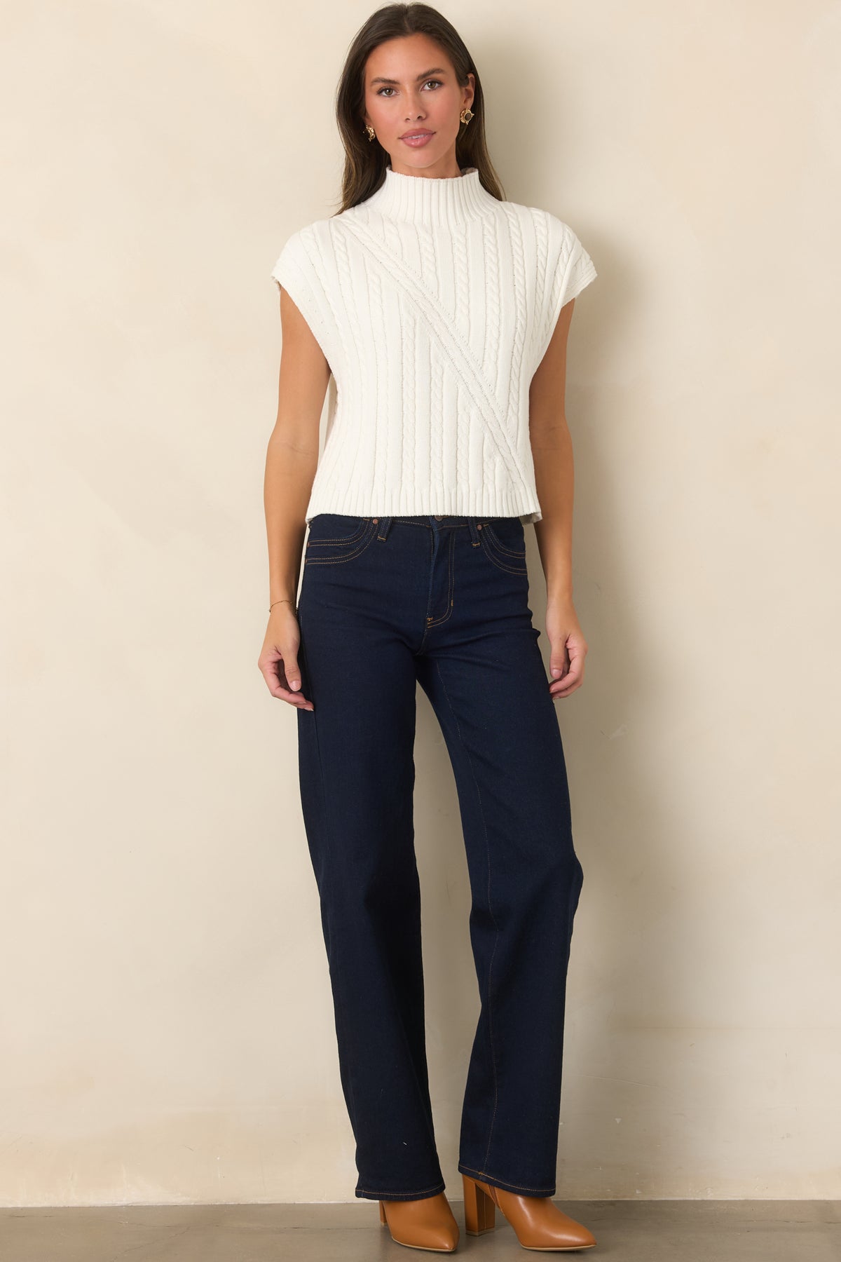 Cotton-rich stretch denim jeans with a polished indigo wash and structured wide-leg shape.