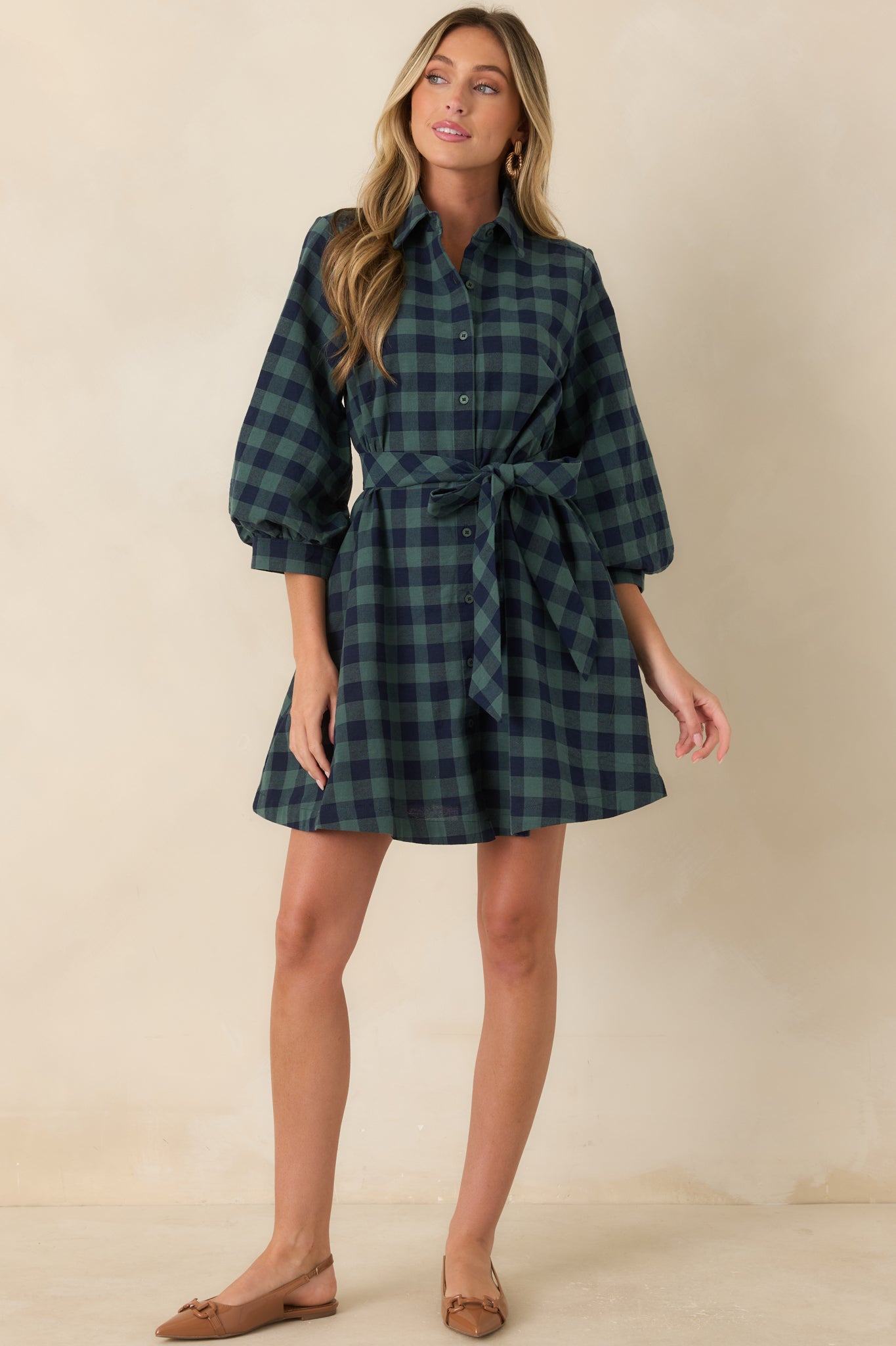 Cotton shirt dress featuring a removable waist tie, softly flared silhouette, functional front buttons, and practical side pockets.