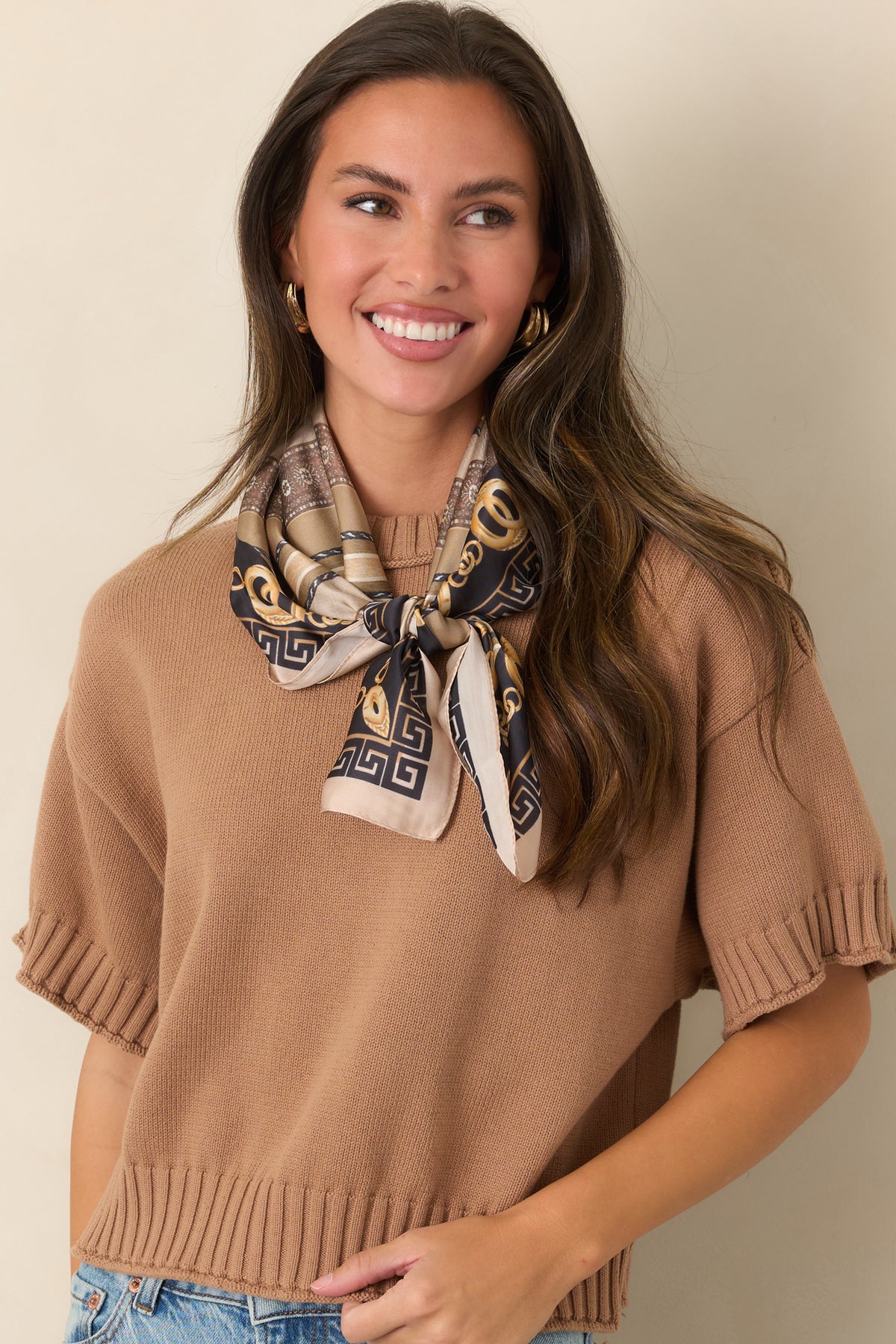 Relaxed short-sleeve top with chunky ribbed trim framing the neckline, cuffs, and hem.