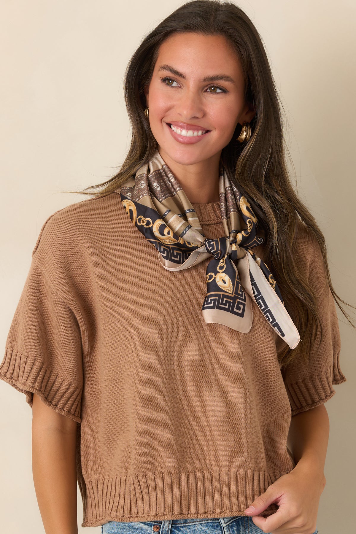 100% cotton top with short sleeves and wide ribbed trim along the hem.