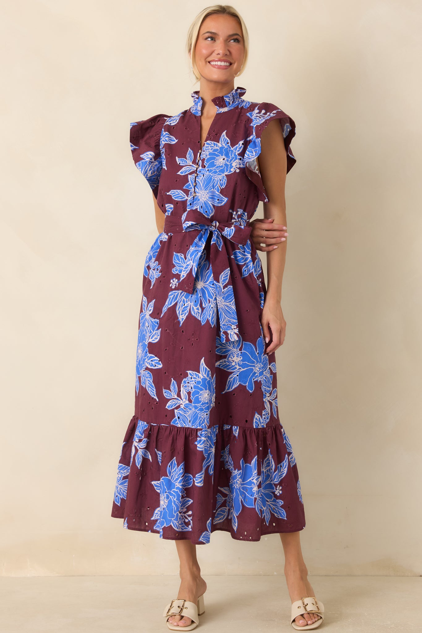 Cotton dress featuring a split V-neckline, flutter sleeves, and a removable self-tie belt for a flattering and versatile silhouette.