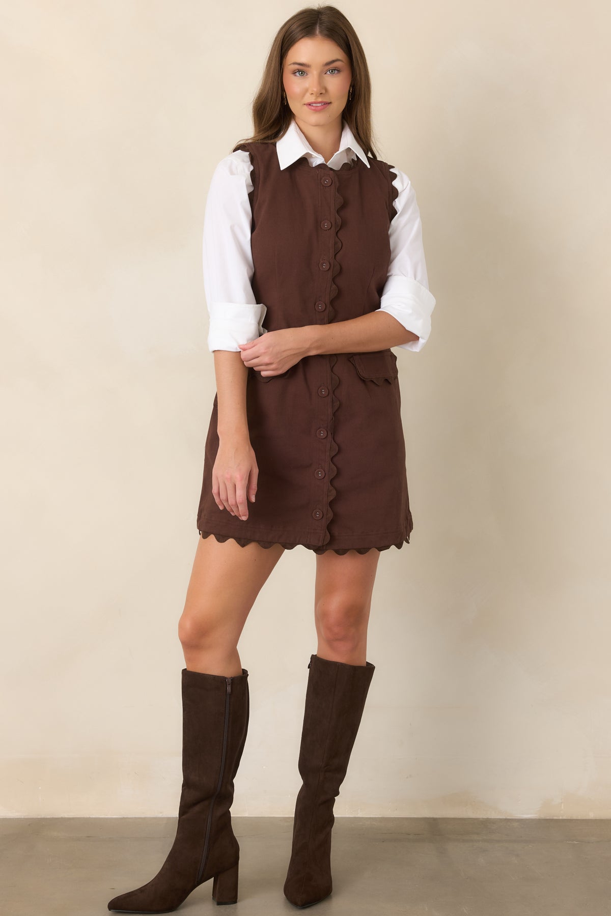 Cotton-rich stretch mini dress with tonal ric rac trim, covered buttons, flap pockets, and a softly shaped waist.