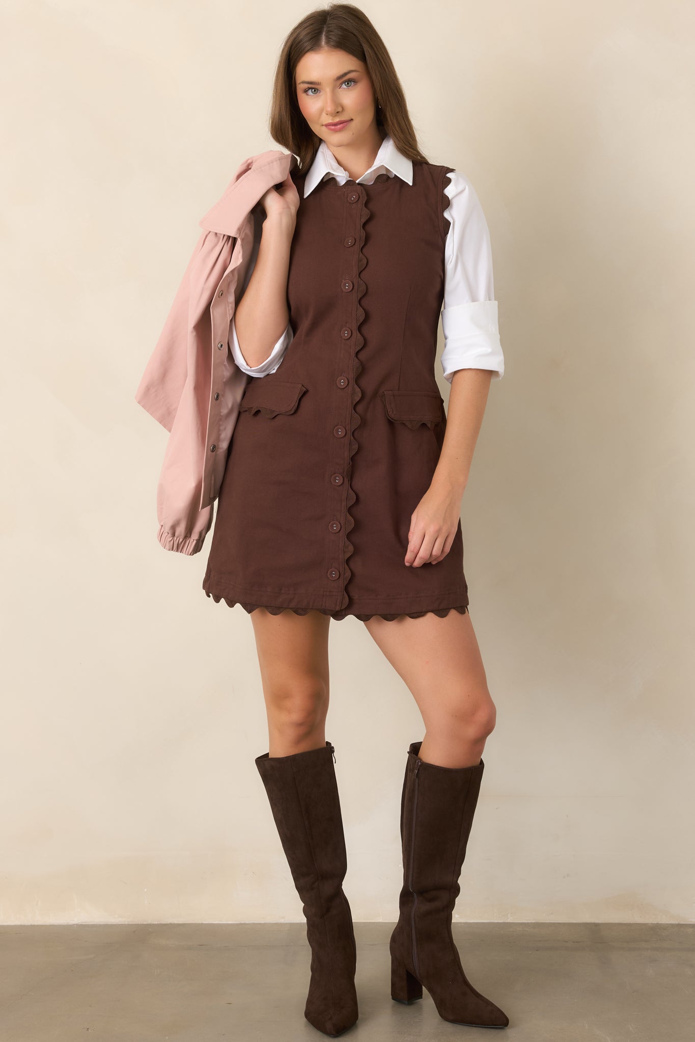 Sleeveless cotton-rich stretch mini dress with tonal ric rac trim, shaping seams, covered buttons, and petite flap pockets.