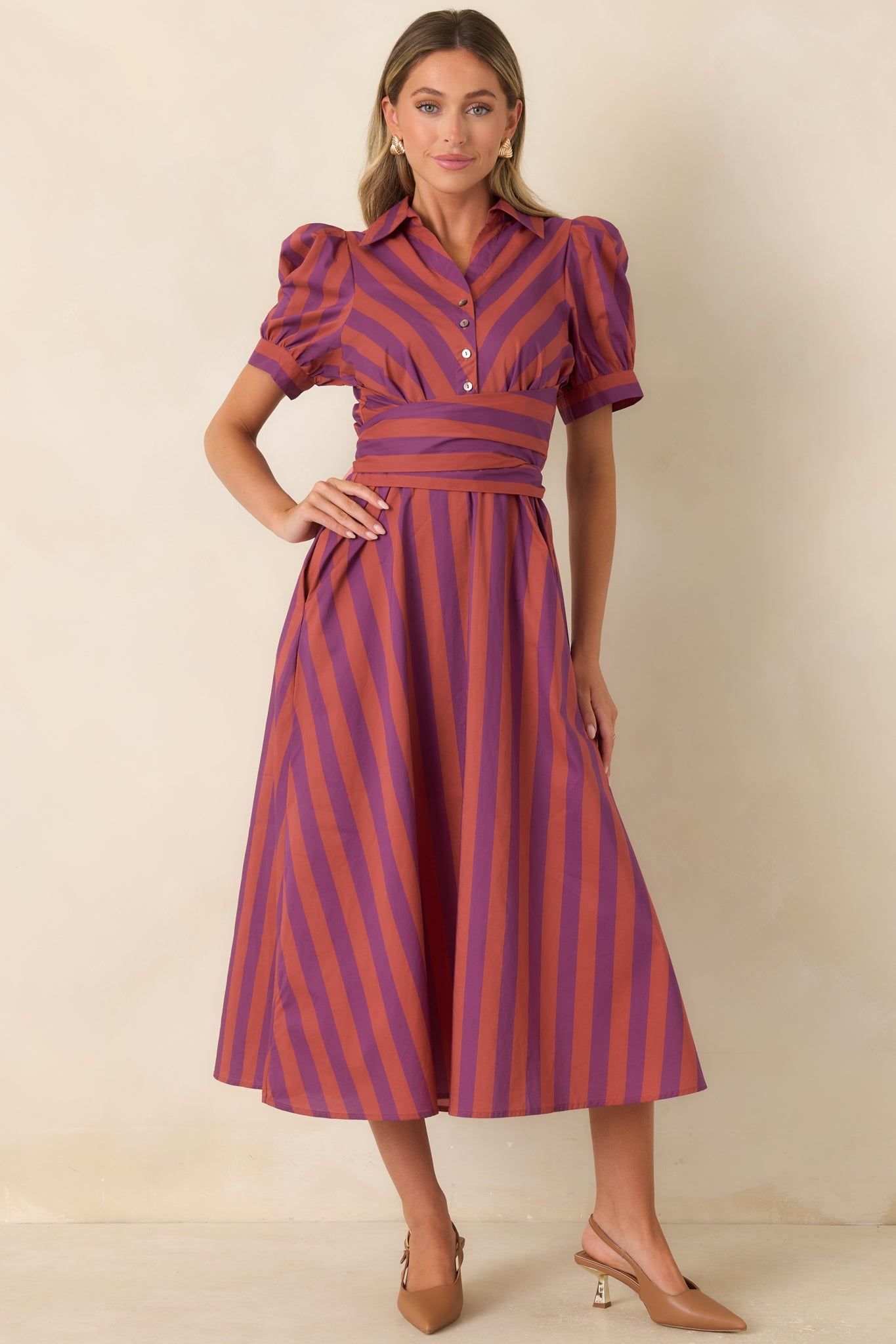 Cotton midi dress designed with alternating plum and burgundy stripes, a classic collar, and a button-front bodice.