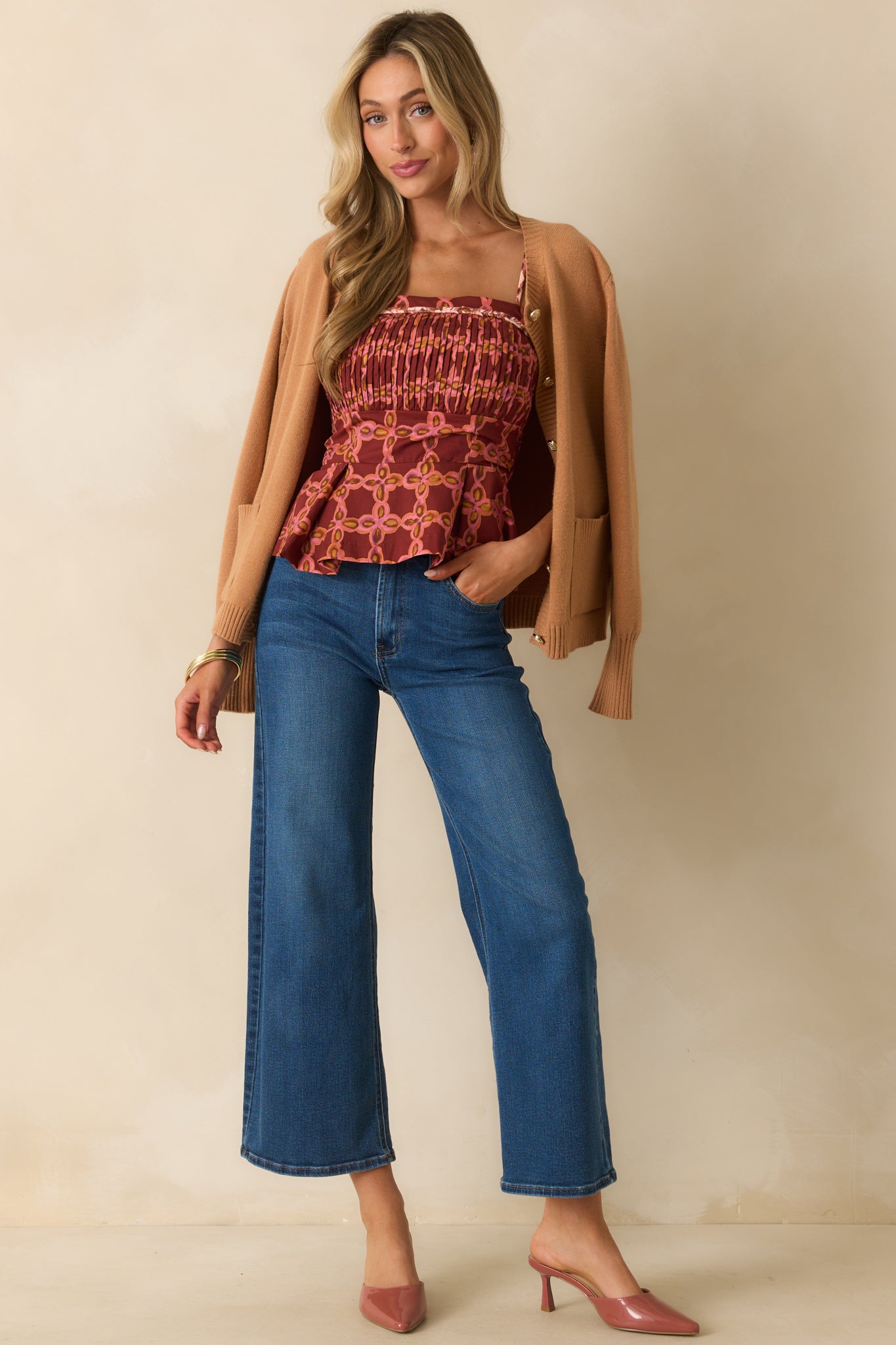 Cotton top with a playful peplum hem, square neckline, and multicolor print.