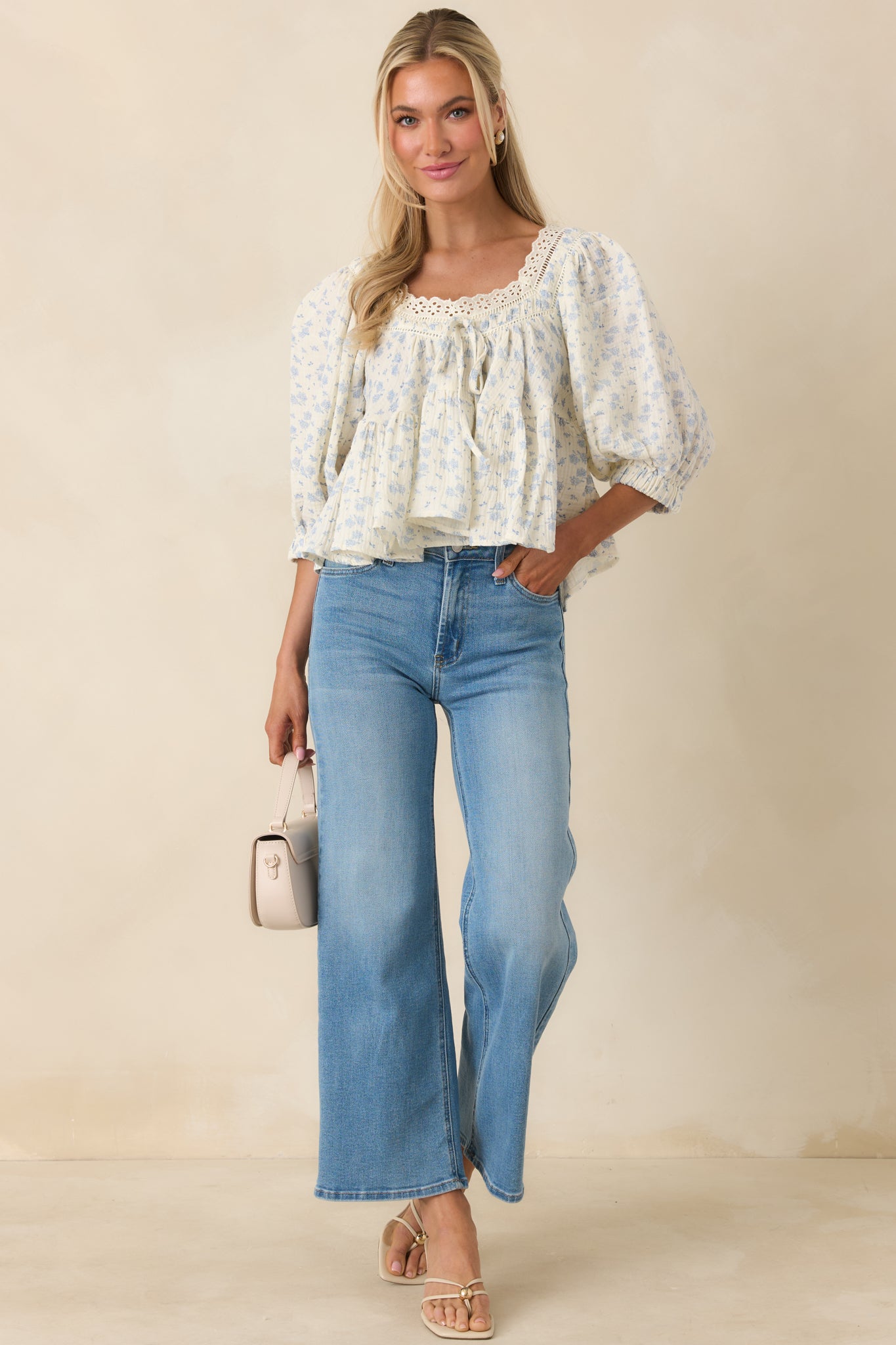 Cotton top with delicate blue floral pattern, scalloped neckline, and easy fit.