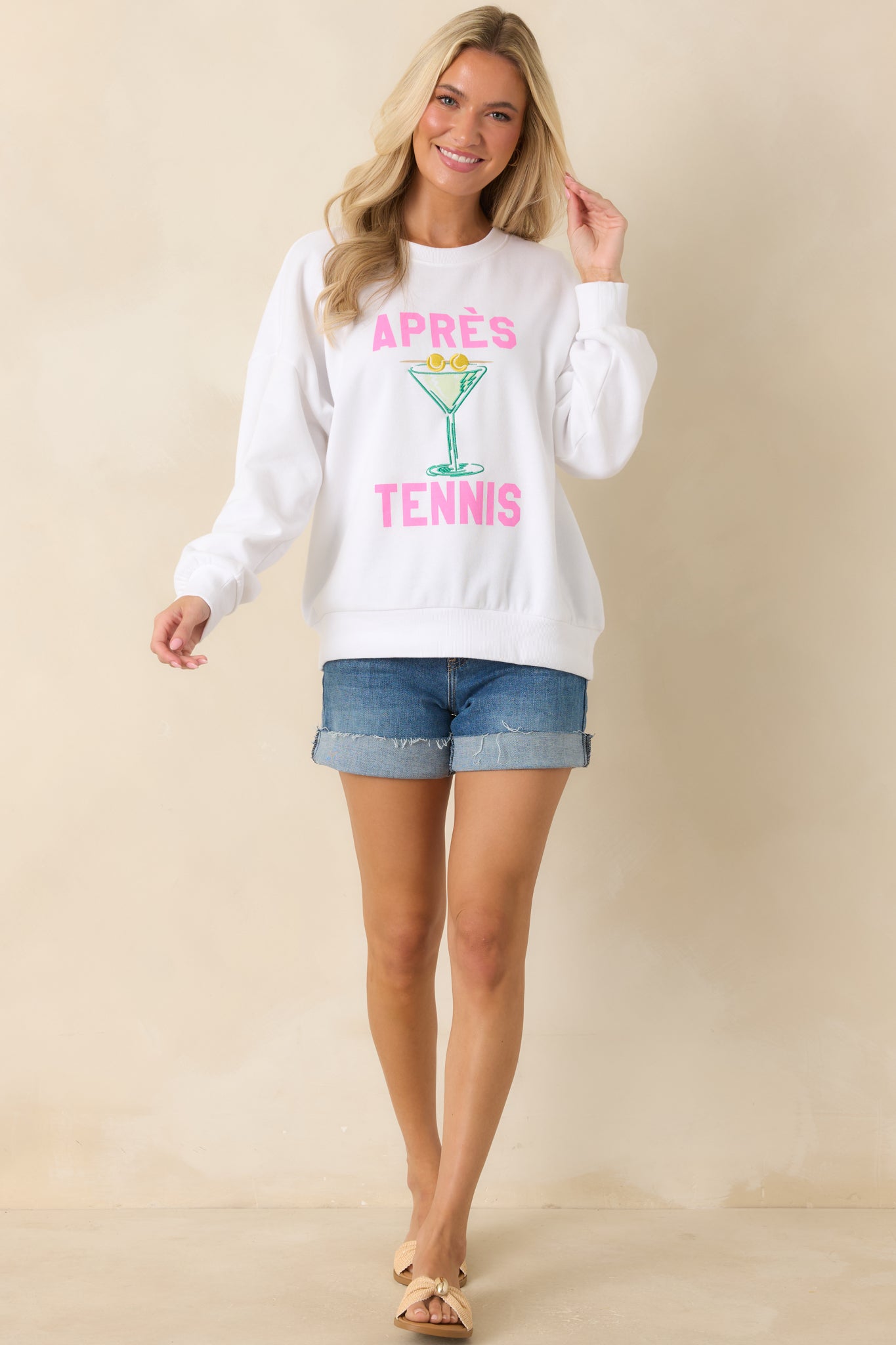 Cozy cotton blend fleece sweatshirt featuring ribbed trim, an oversized silhouette, and a sporty embroidered graphic with bold lettering.