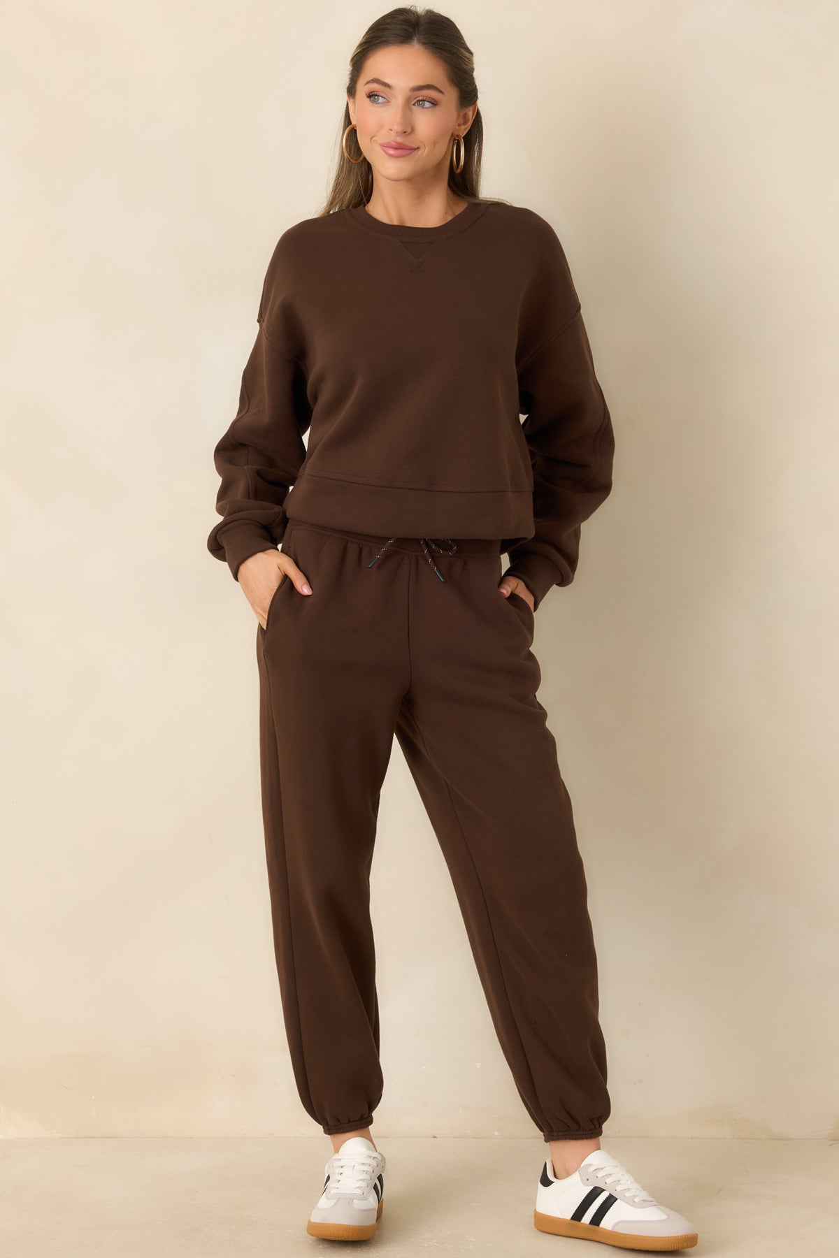 Cozy fleece top with a classic crew neckline and softly structured long sleeves.
