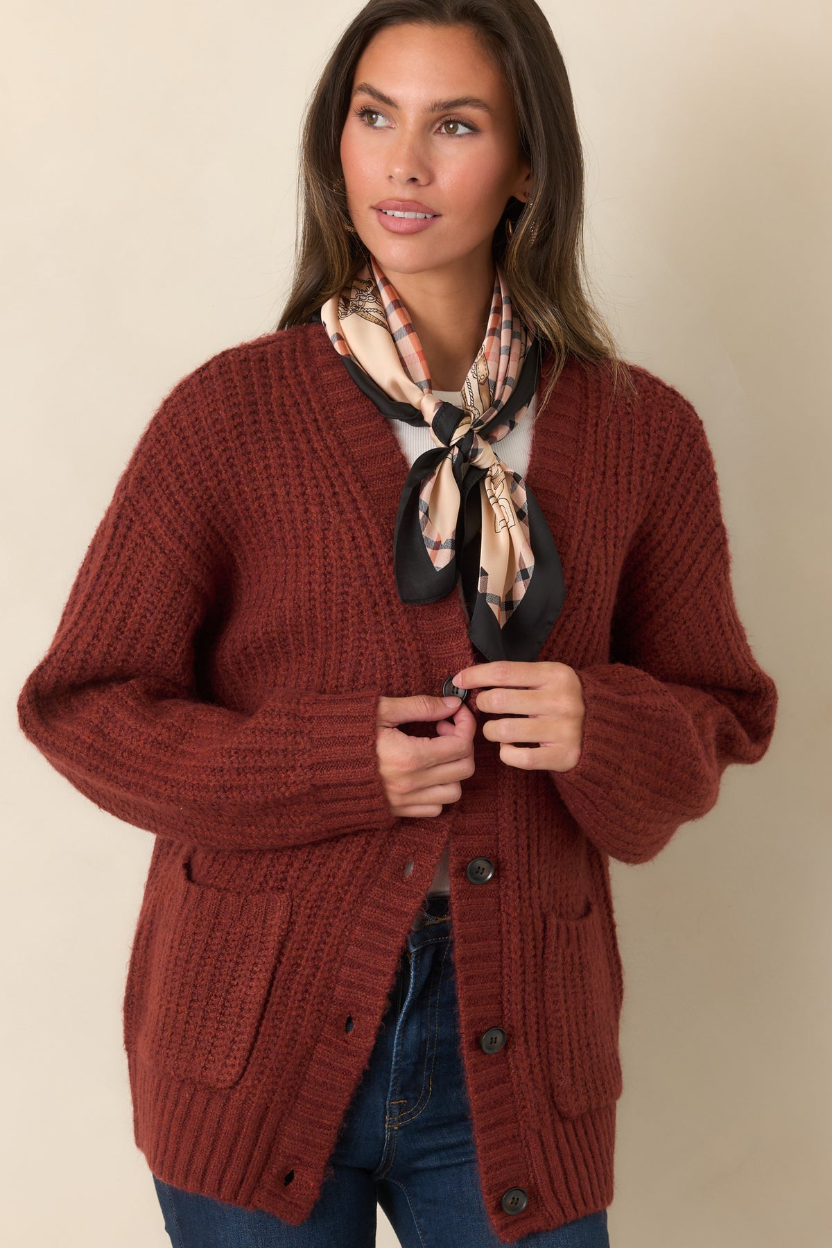 Cozy mixed-fiber cardigan showcasing the oversized shoulder shape, long sleeves, and softly textured knit construction.