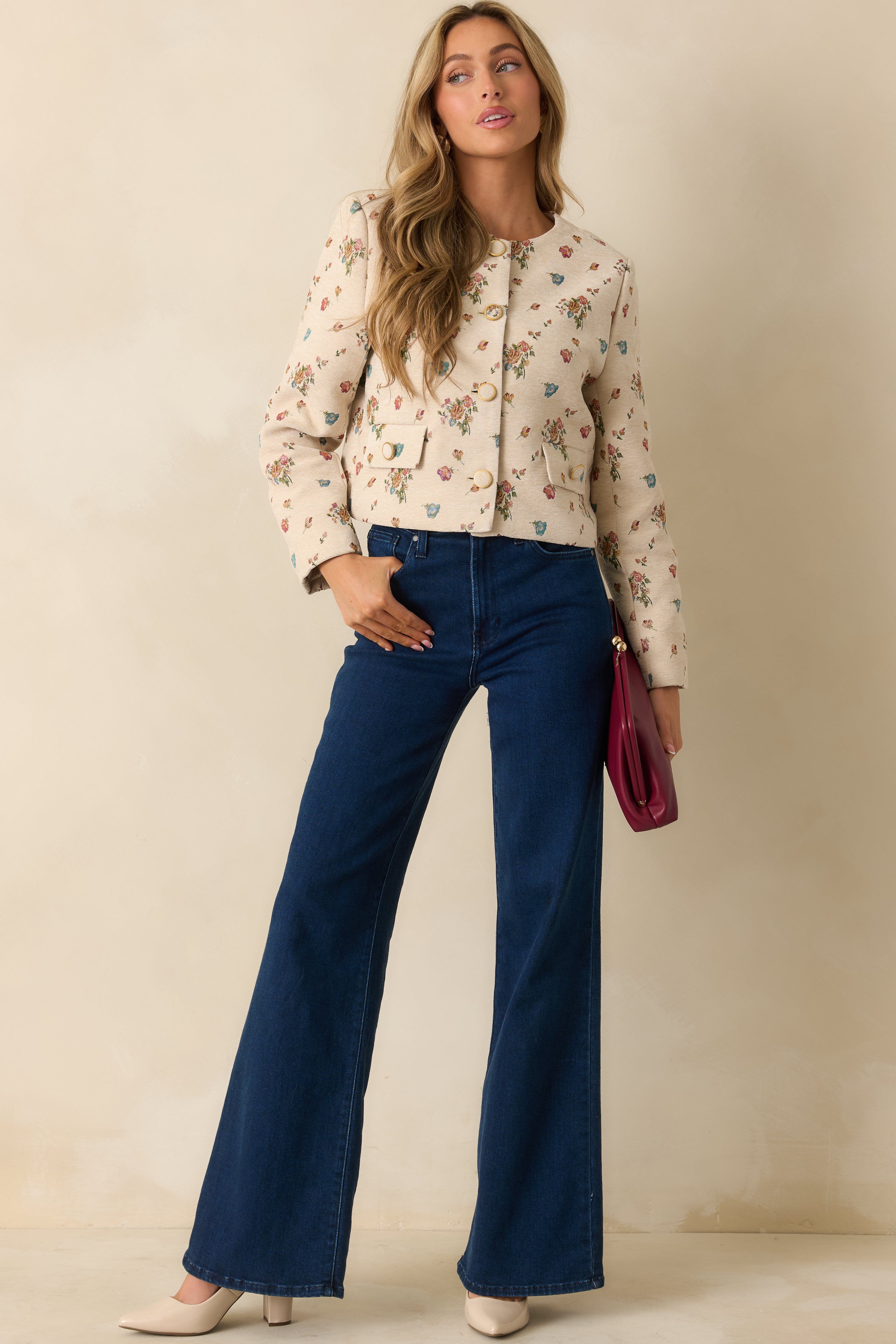 Cropped cream tapestry jacket with a round neckline and tailored silhouette.