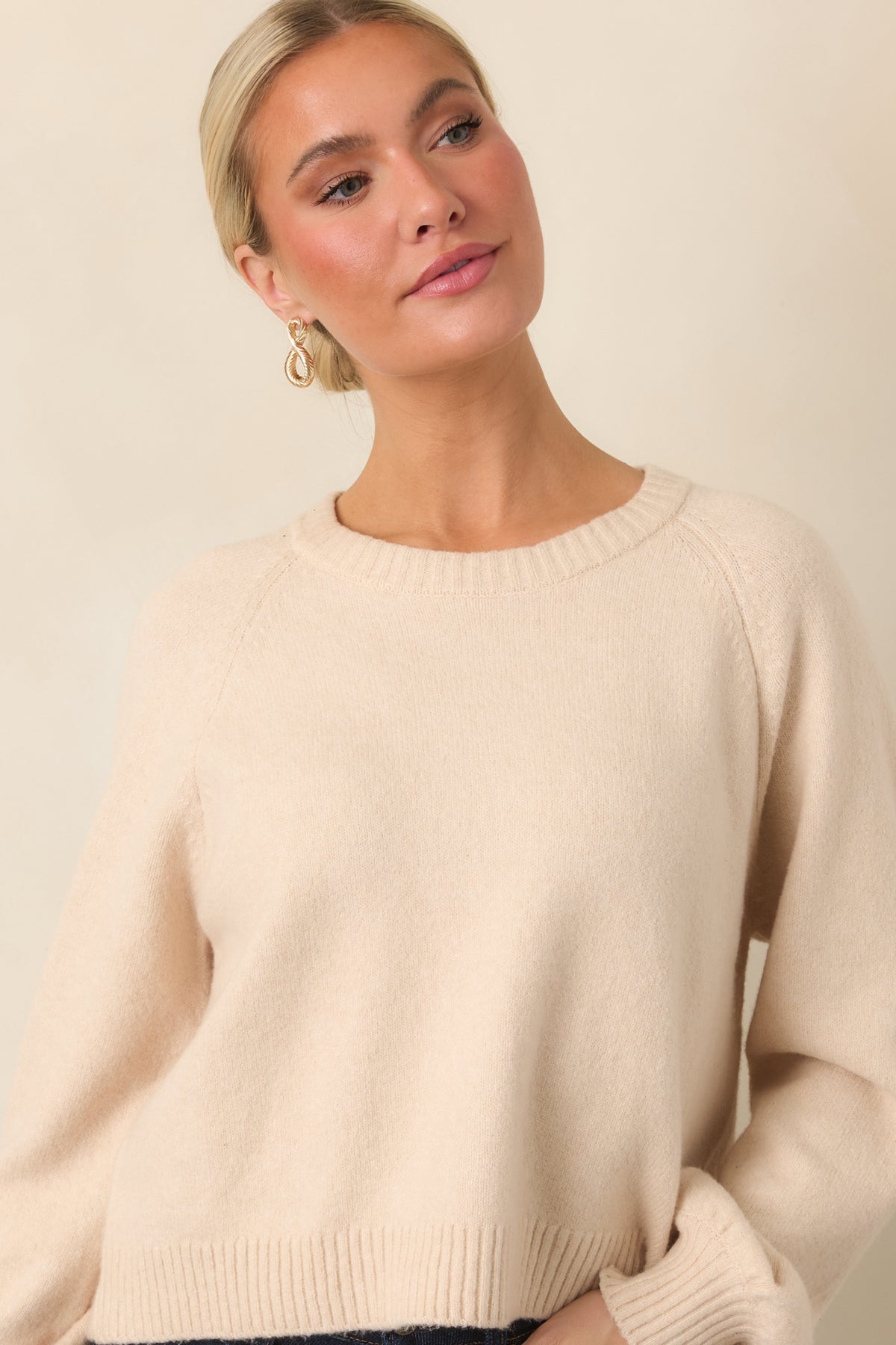 Long-sleeve crew neck top finished with ribbed trim along the neckline, cuffs, and hem.