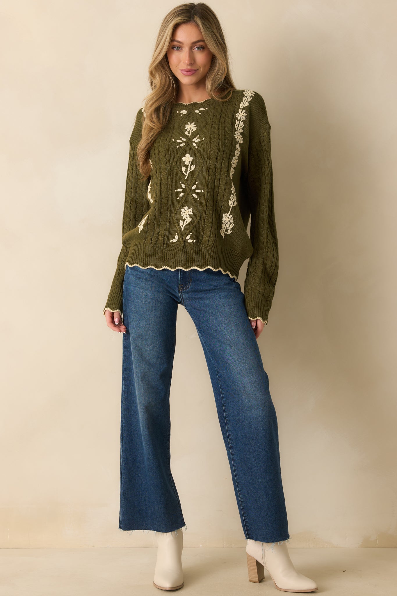Crewneck cable knit sweater in olive with delicate ivory embroidery and scalloped edge accents.