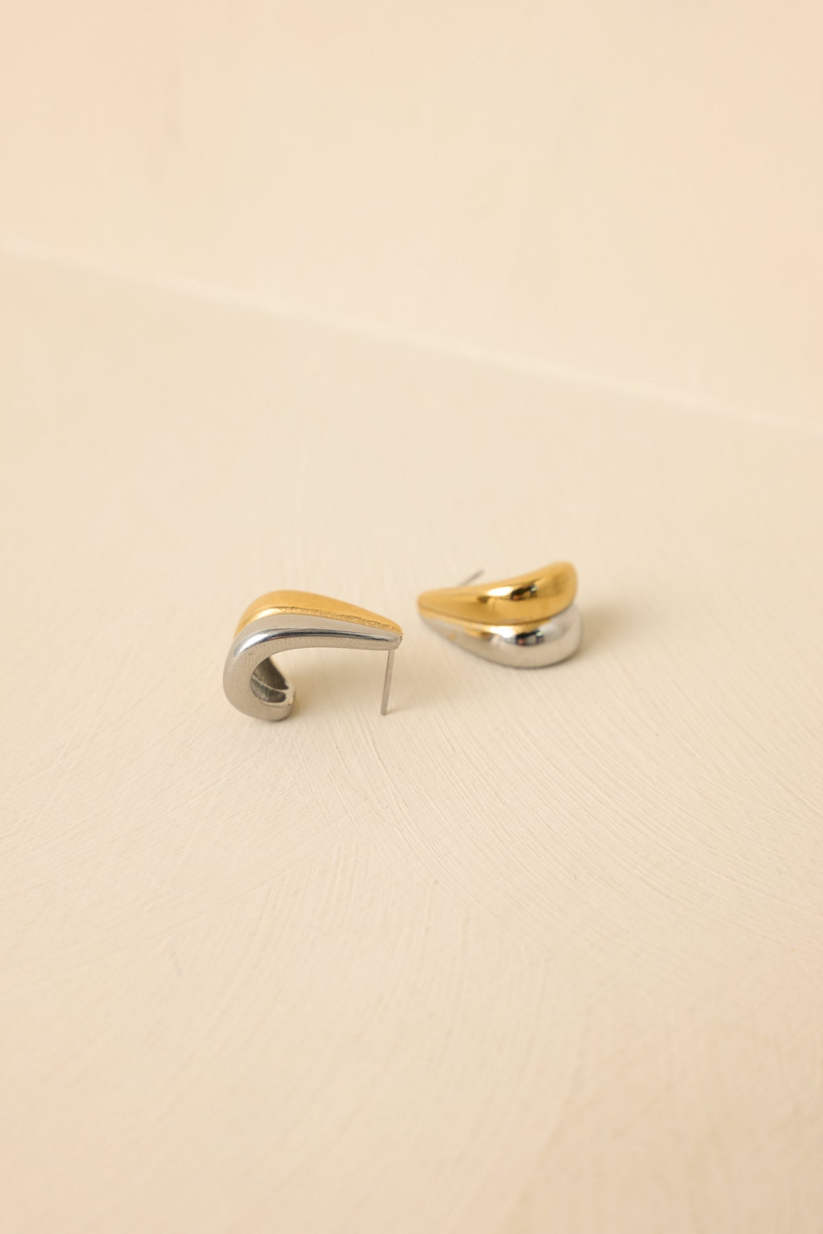 Tight cropped angle focusing on curved sculptural shape and polished surface.