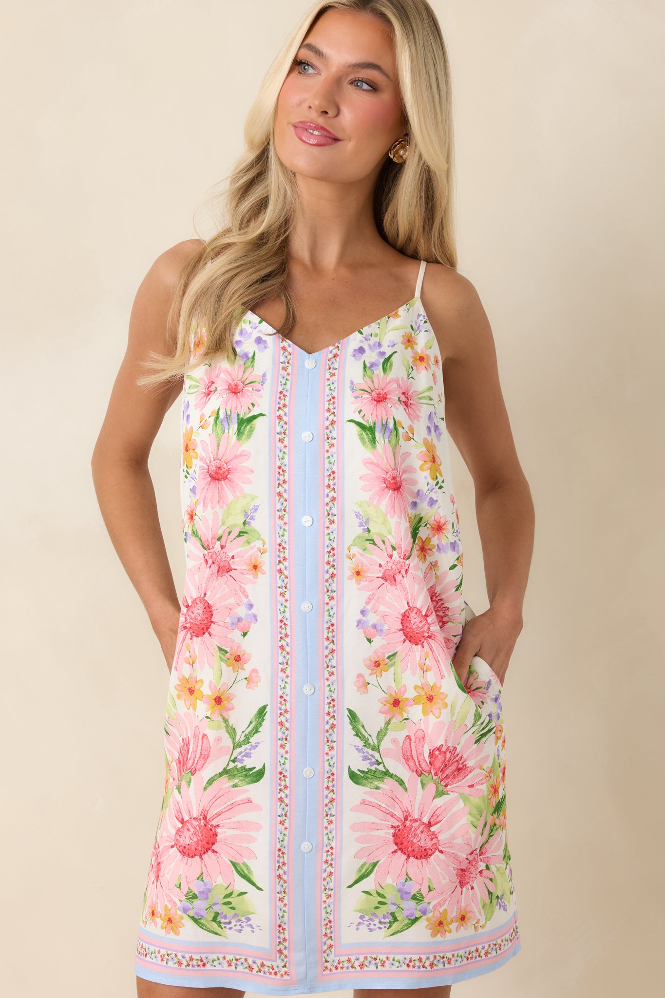 Cropped front view focusing on the neckline, spaghetti straps, and floral pattern at the upper bodice.