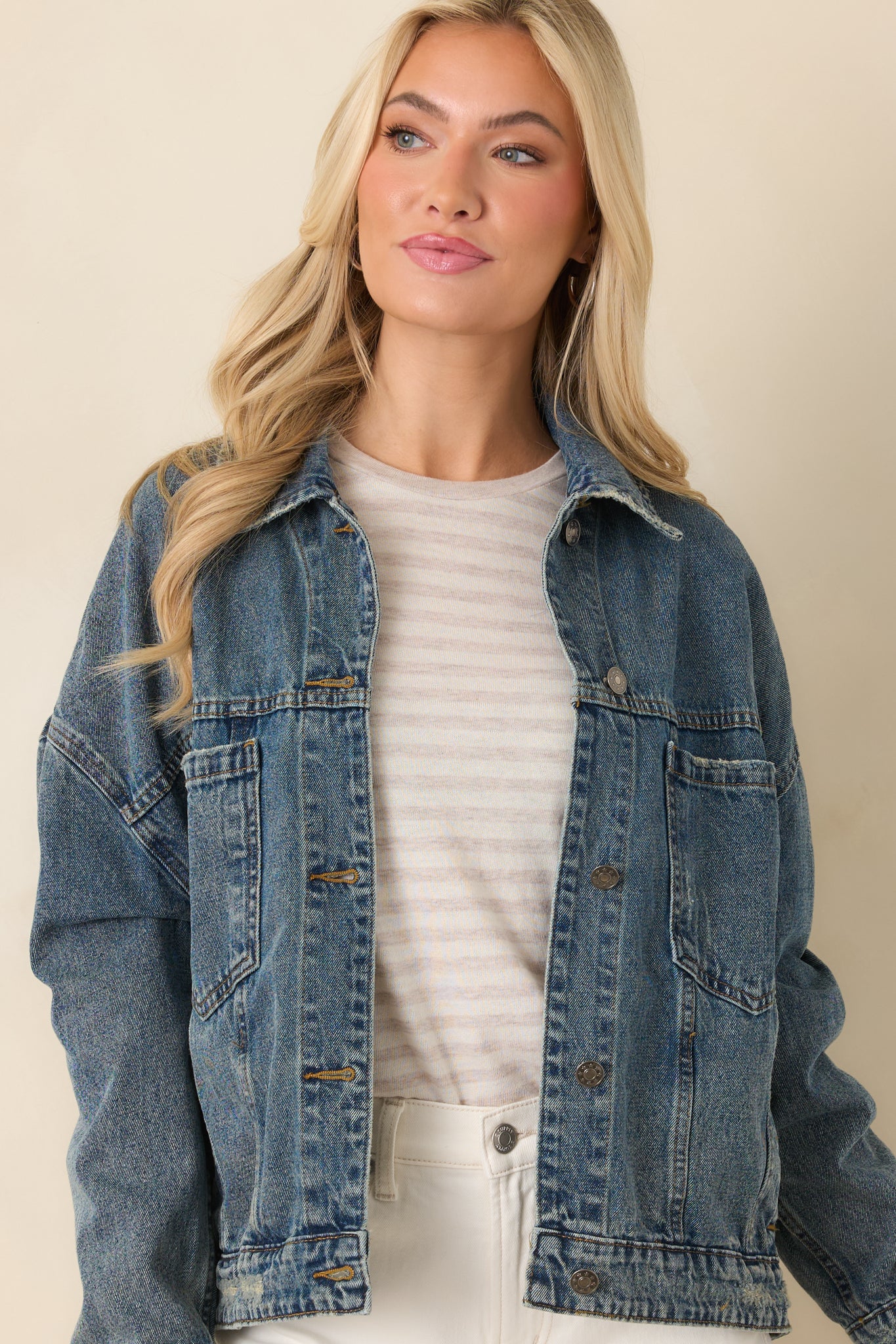 Close-up cropped front showing the cotton denim texture and relaxed silhouette.