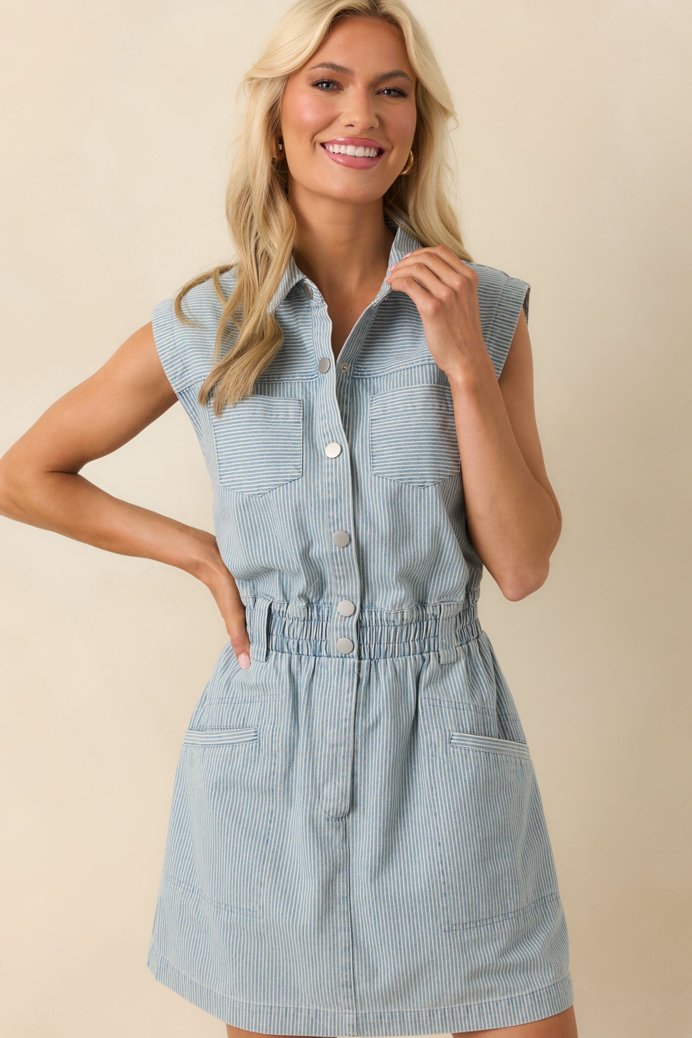 Front-facing cropped shot focusing on collar, pinstripes, and button-front details.