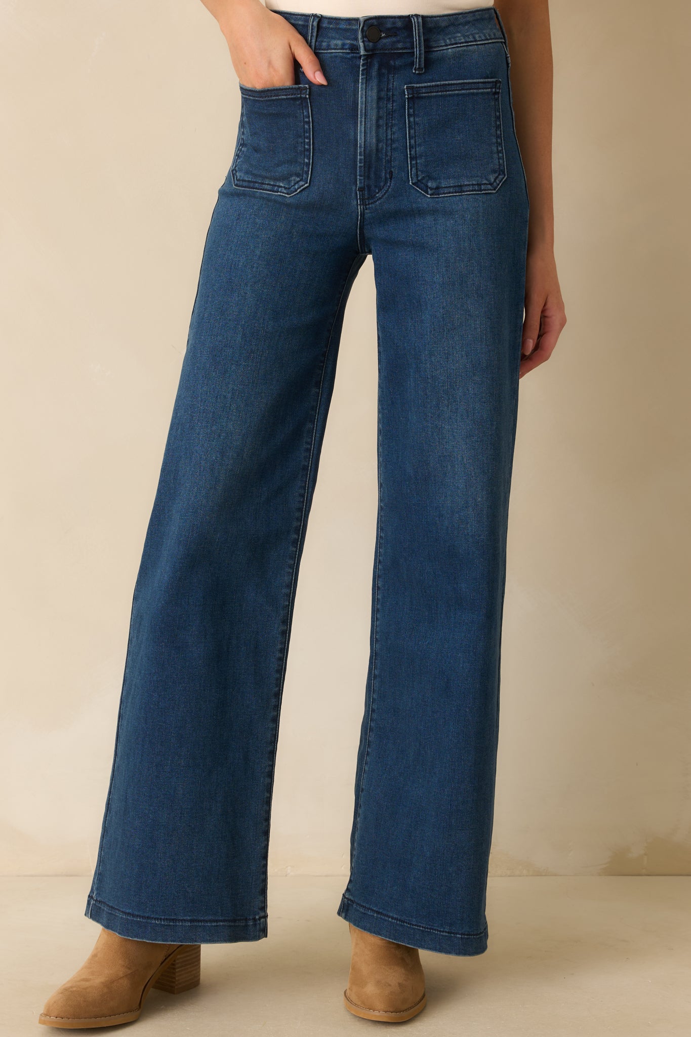 Cropped front view highlighting high-rise waistband and front patch pockets