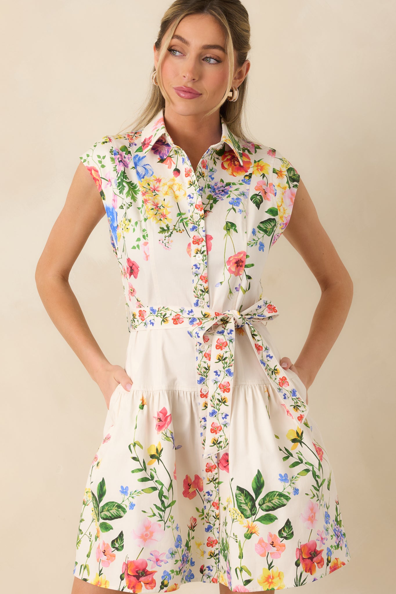 Cropped front view of the mini dress focusing on the collared neckline and button-front detail.